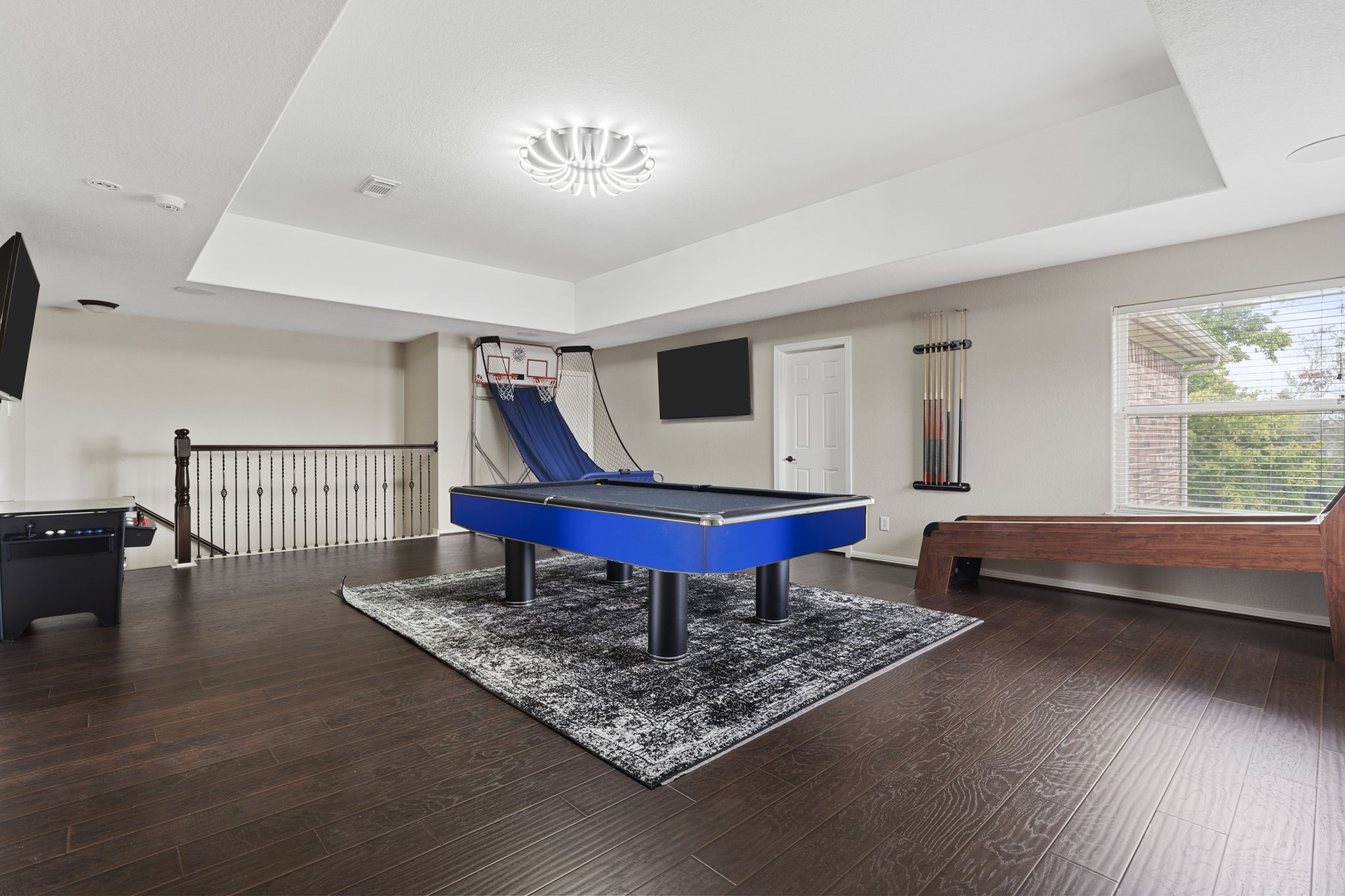 Fun and functional game room offering a versatile space for entertainment, recreation, and quality time with family and friends.