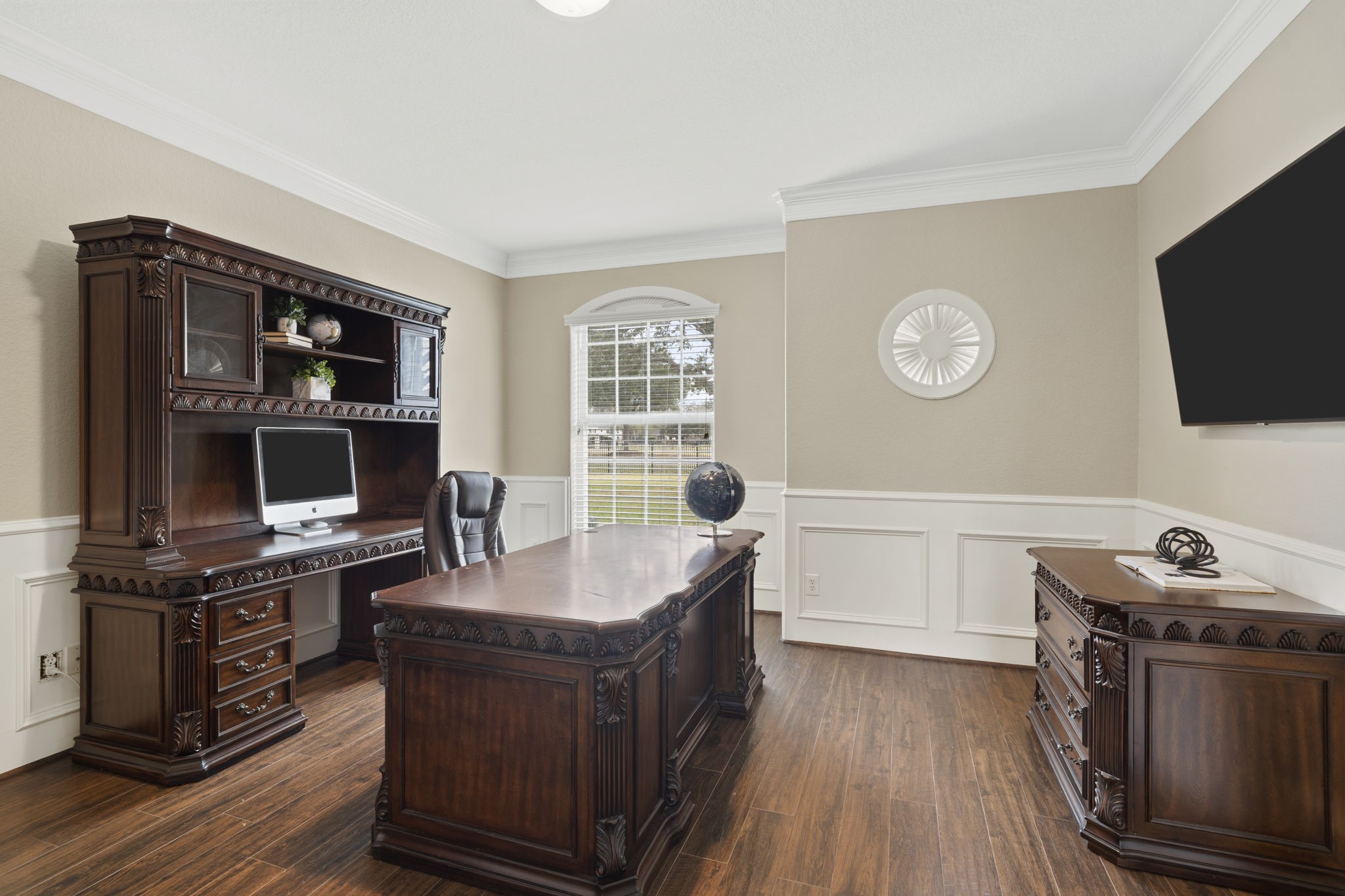 Expansive home office offering a sophisticated and functional space to work from home.