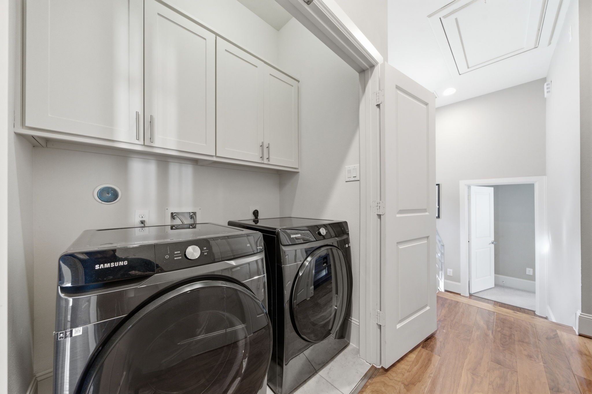 The dedicated utility space keeps laundry tucked away while remaining easily accessible.