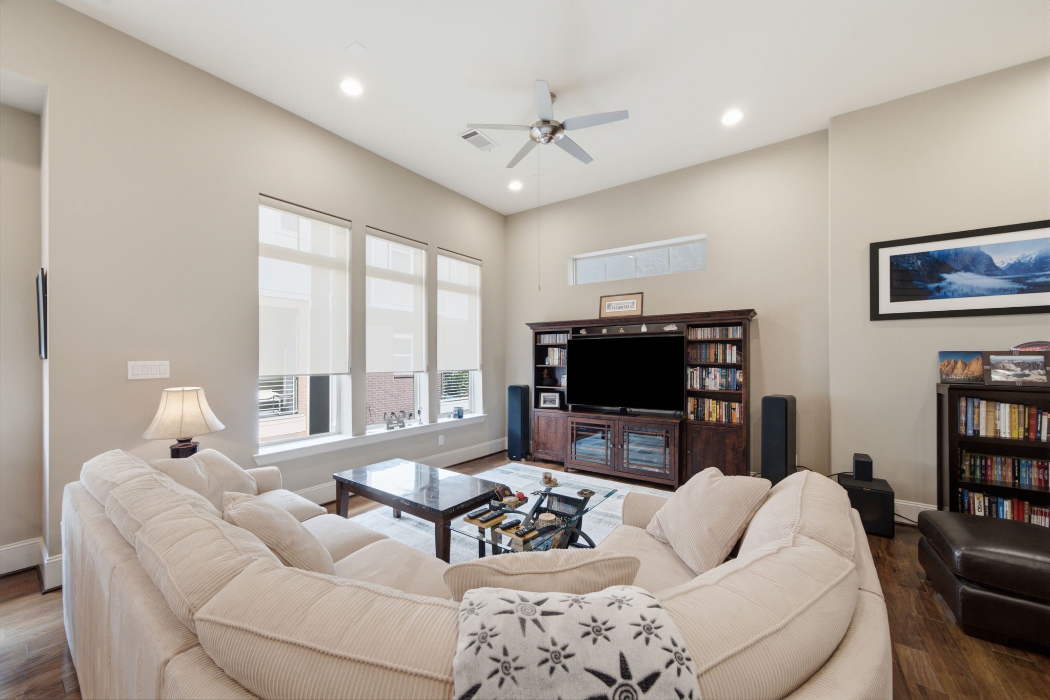 The spacious living room is filled with natural light and offers the perfect place to gather with family and friends.