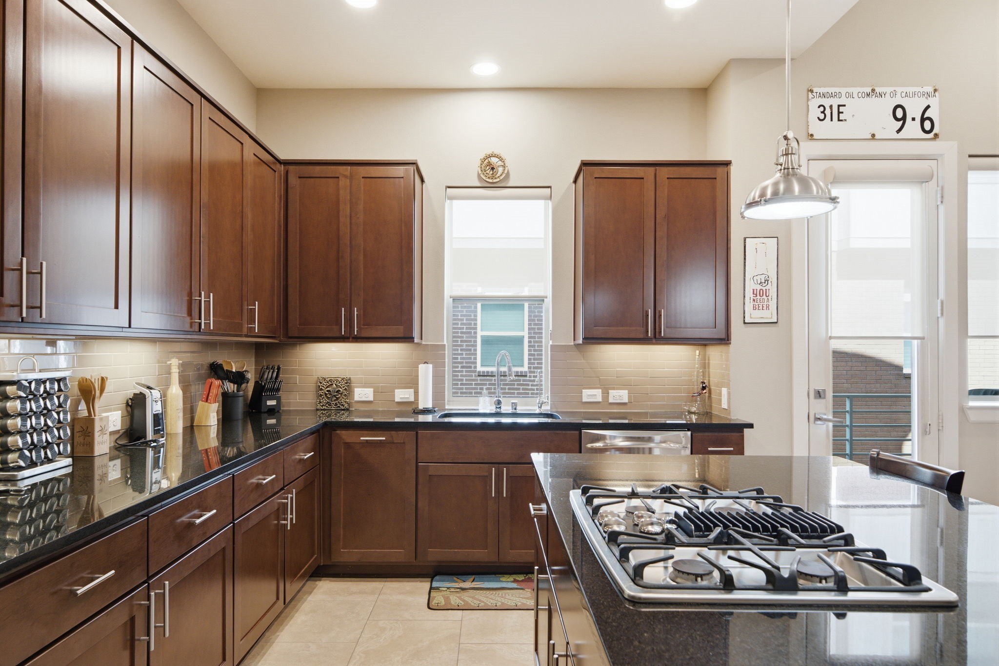 Preparing meals is both functional and enjoyable with generous cabinetry and expansive counter space.