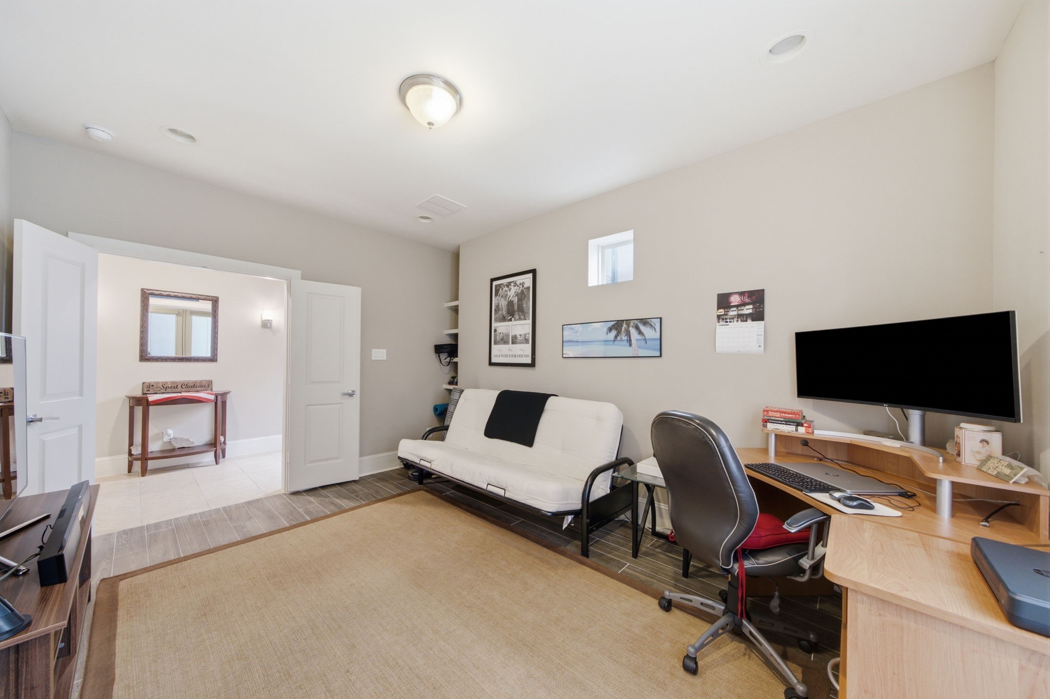 The first-floor bedroom with an adjacent full bath offers incredible flexibility for guests, a home office, or multigenerational living.