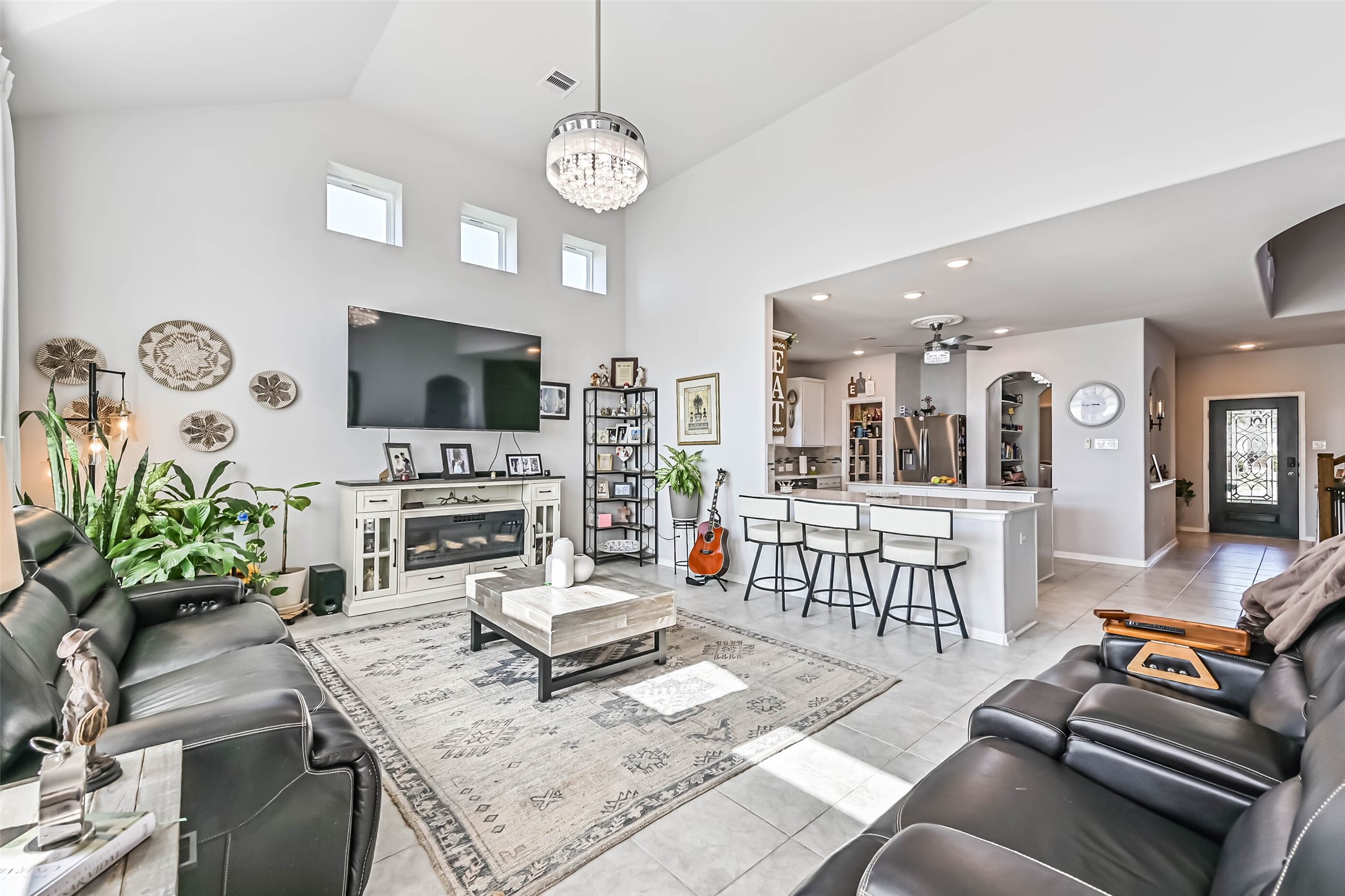 Spacious living room seamlessly connects to the kitchen and breakfast bar, creating an ideal layout for entertaining and everyday living.