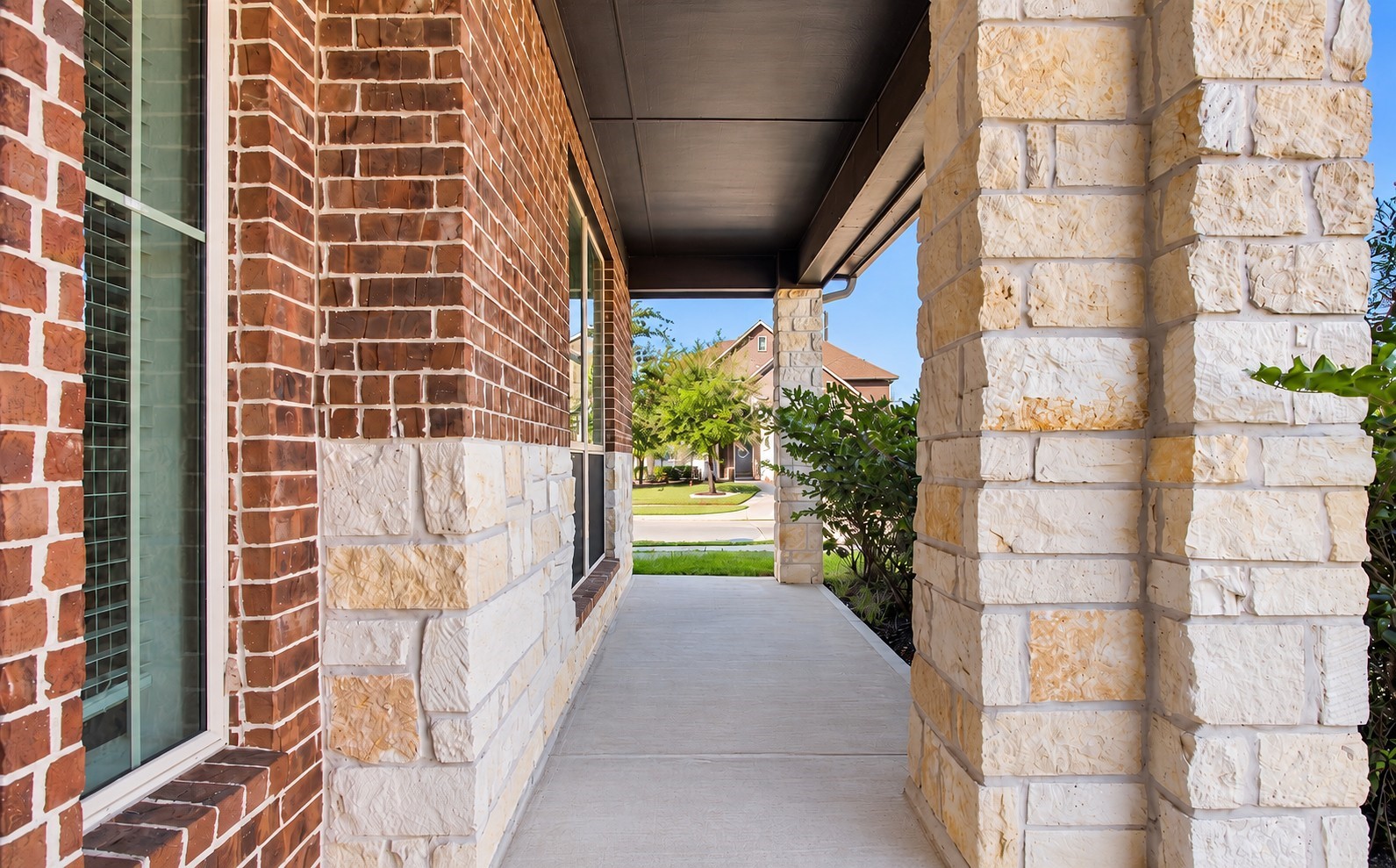 Covered front porch, with plenty of room to sit and unwind.