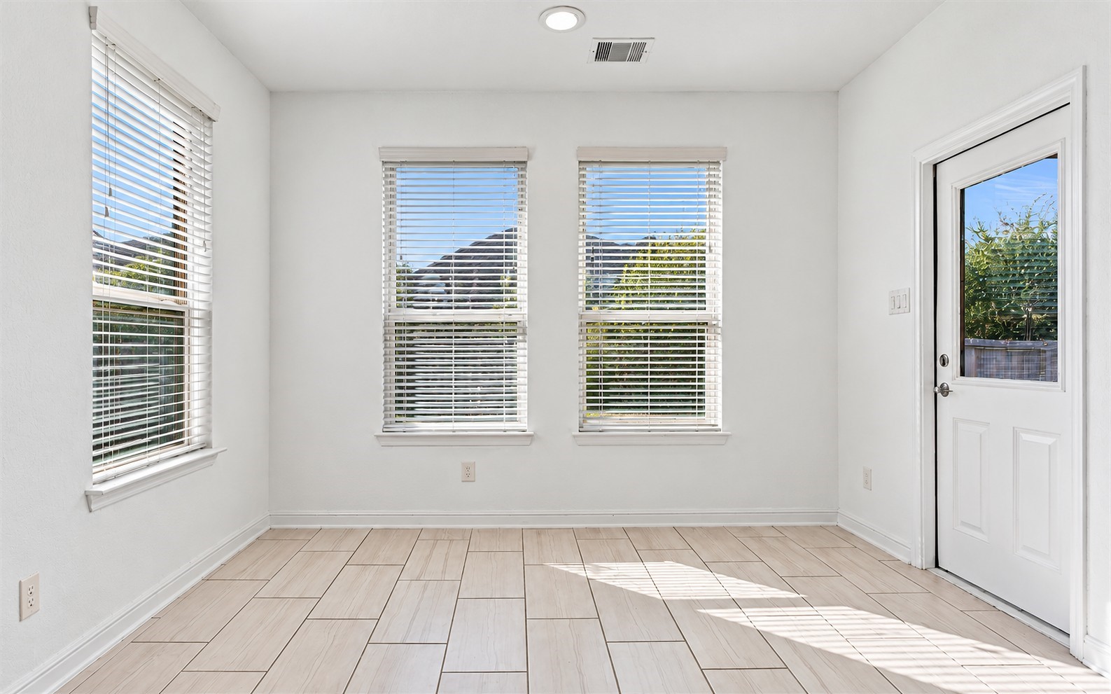 Start your mornings in this sun-filled breakfast nook with large windows that bring in all the natural light you could ask for.