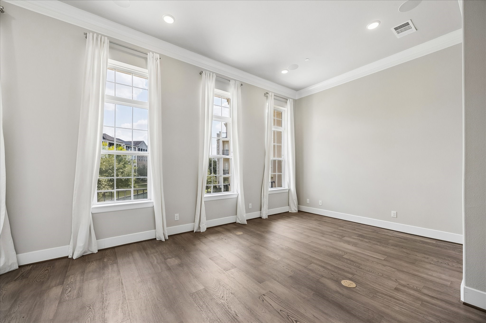Sophisticated yet comfortable, this inviting living area serves as the centerpiece of the home's open-concept design.
