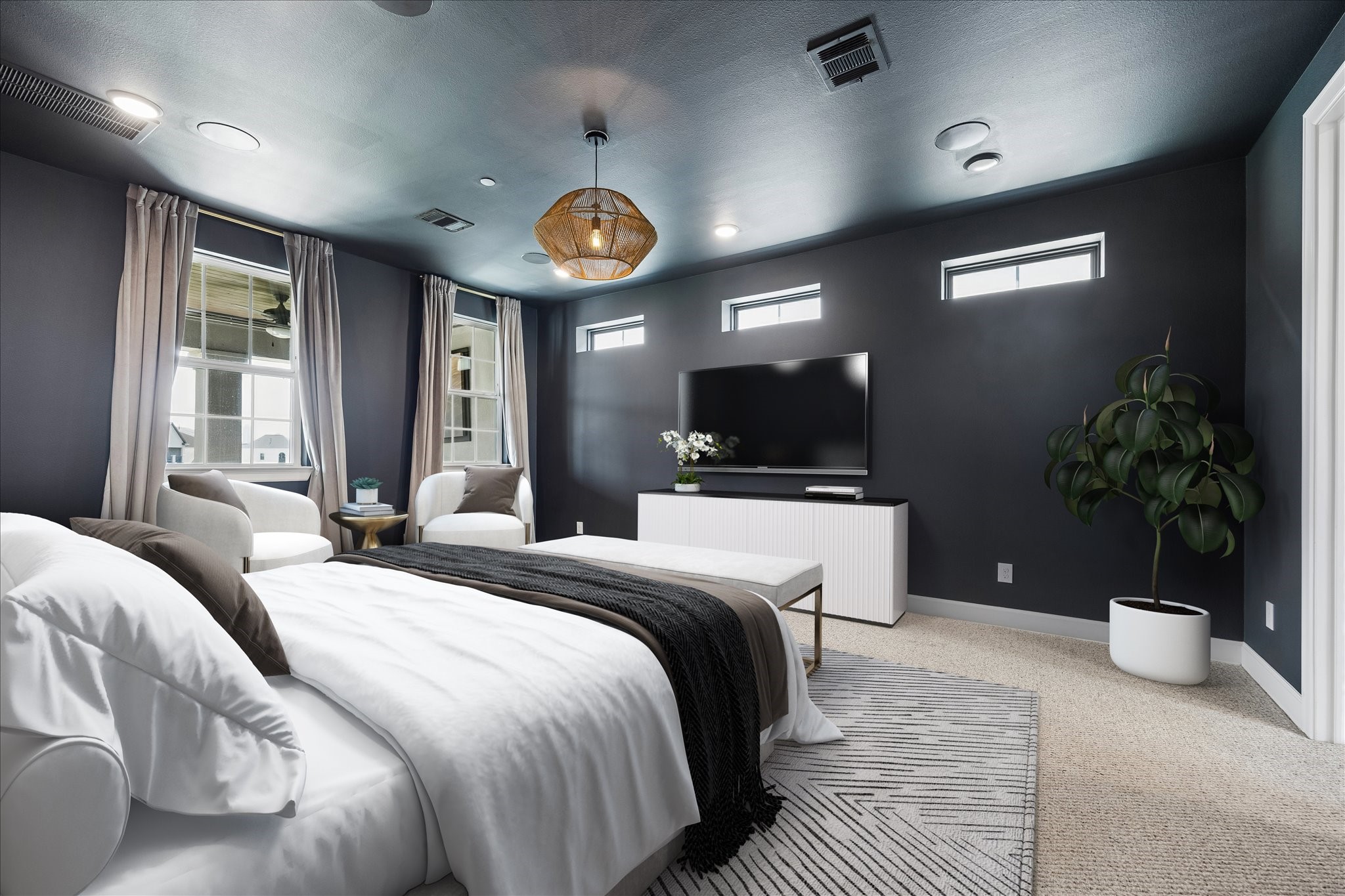 Generously sized and bathed in natural light, the primary bedroom combines comfort, privacy, and elegance. Photo virtually staged.