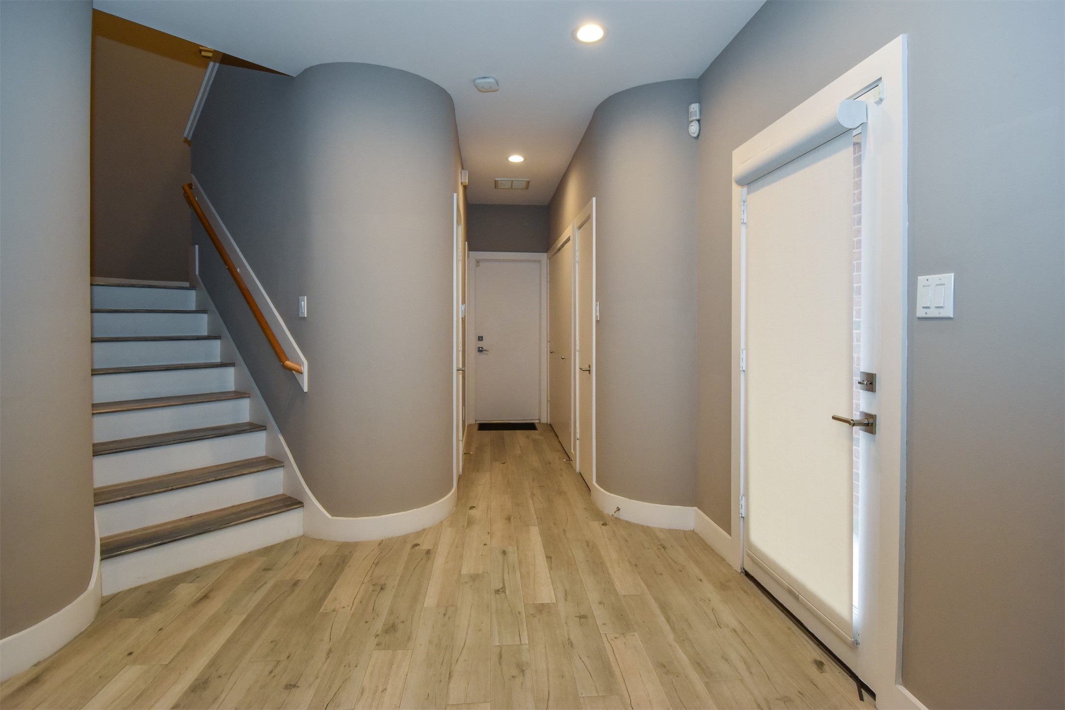 Foyer.  Note the rently updated  laminate floor throughout the home and fresh interior paint.
