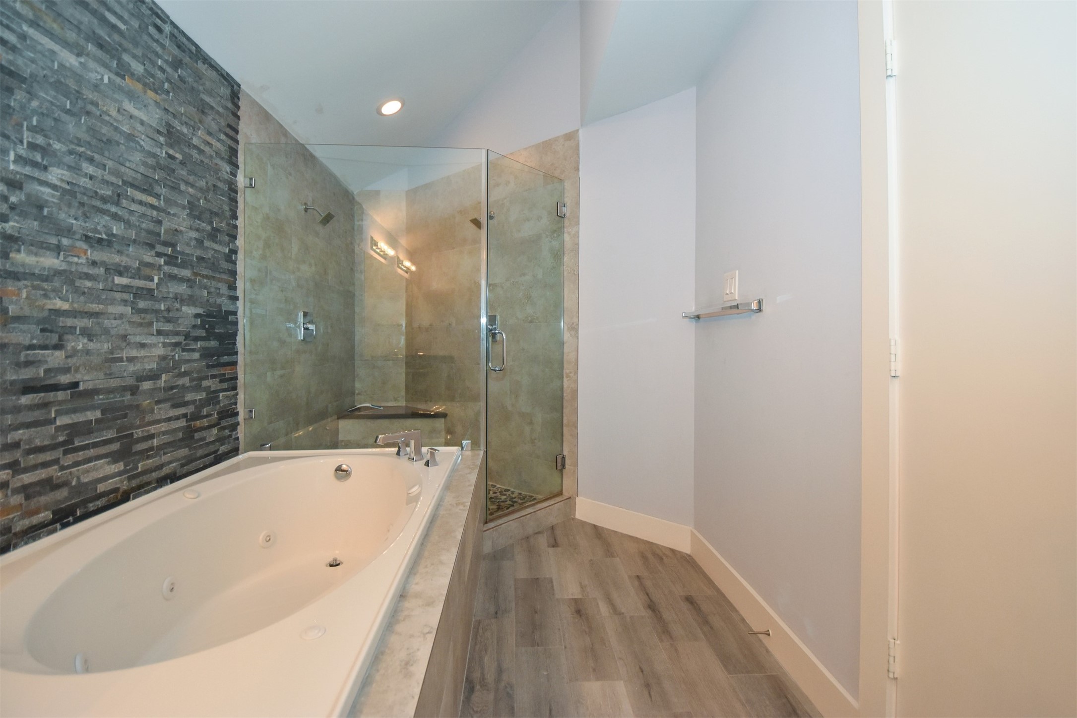 Updated Primary Bathroom with whirlpool Tub & Seam-less Shower with dual shower heads.