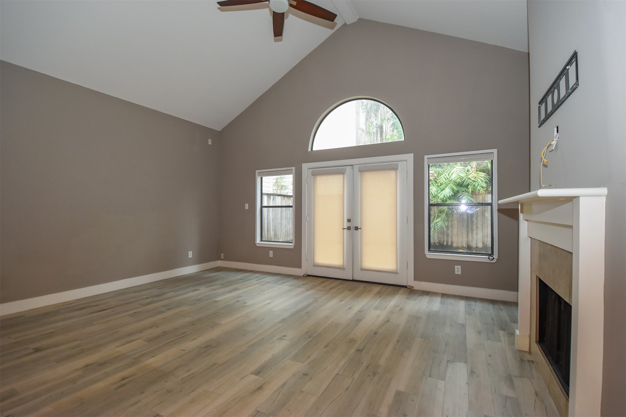 Family room with French door leading to enclosed back Patio.