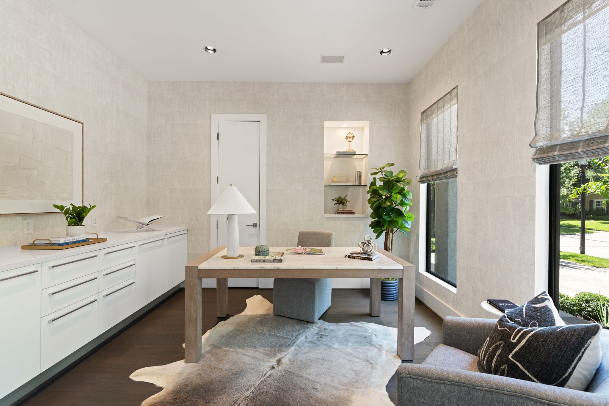Downstairs office with ample storage and natural light.