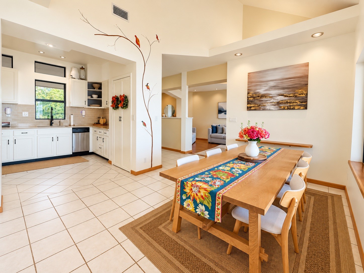 Bright and inviting open-plan kitchen and dining area featuring modern white cabinetry.