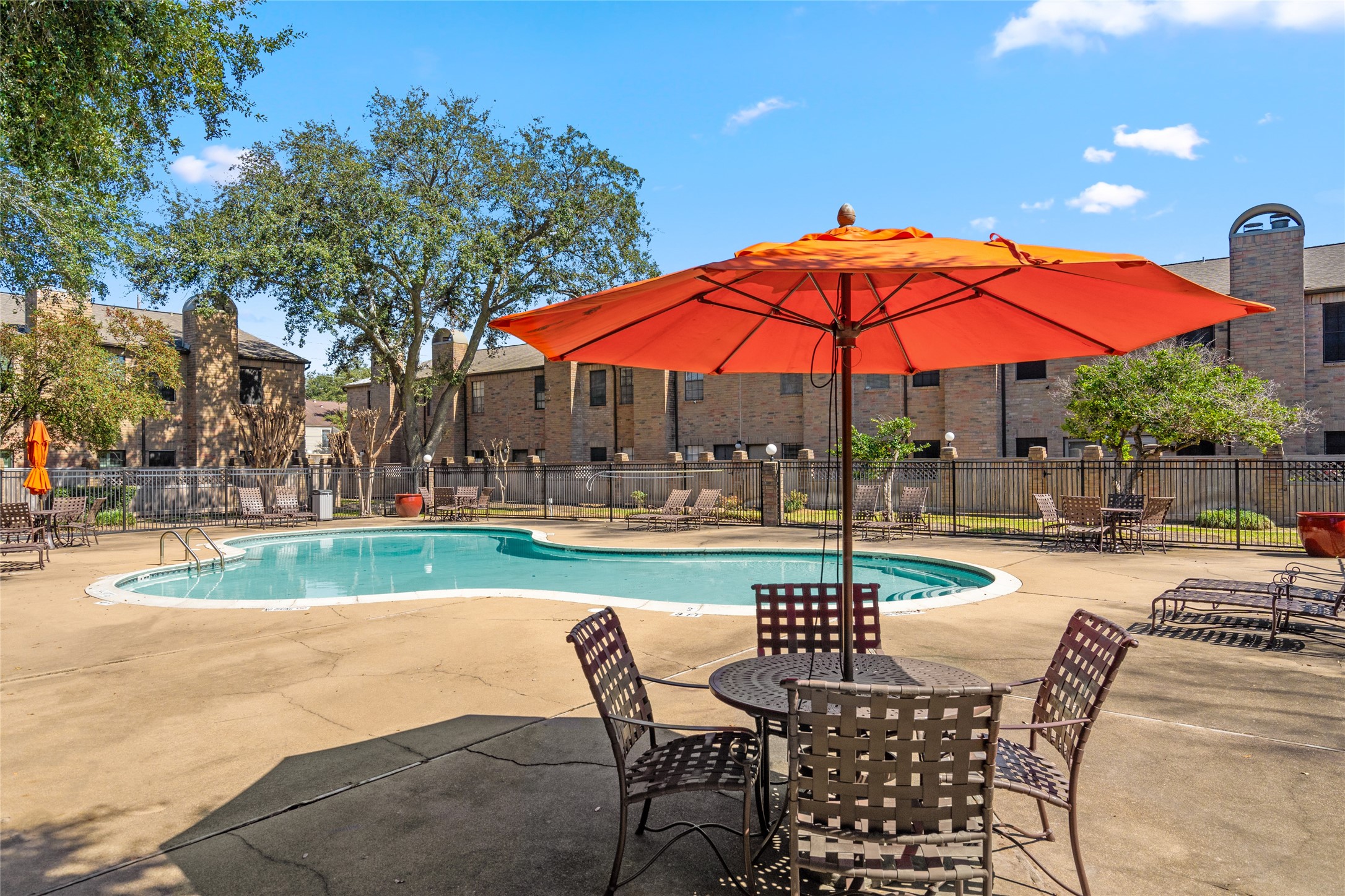 Relax and unwind at the beautifully maintained community pool! Whether you're soaking up the sun on a lounge chair or cooling off with a refreshing swim, this serene space is perfect for leisure and entertaining. Enjoy the shaded seating areas, lush surroundings, and a peaceful retreat right outside your door!