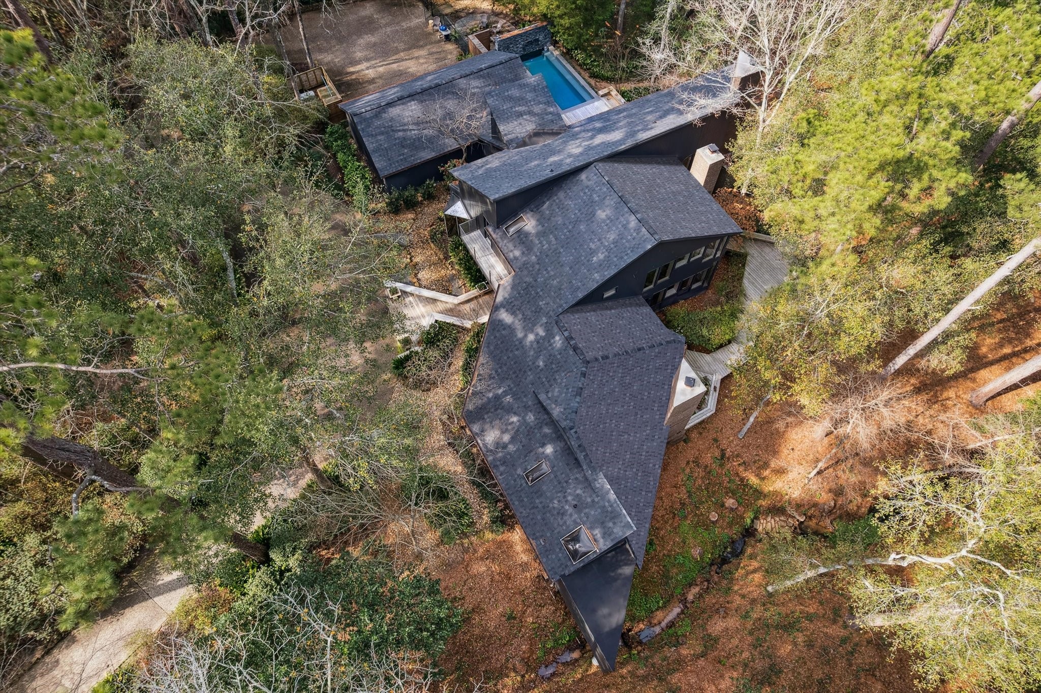 Rare architectural treasure tucked among mature trees, creating a serene, elevated treehouse hideaway.