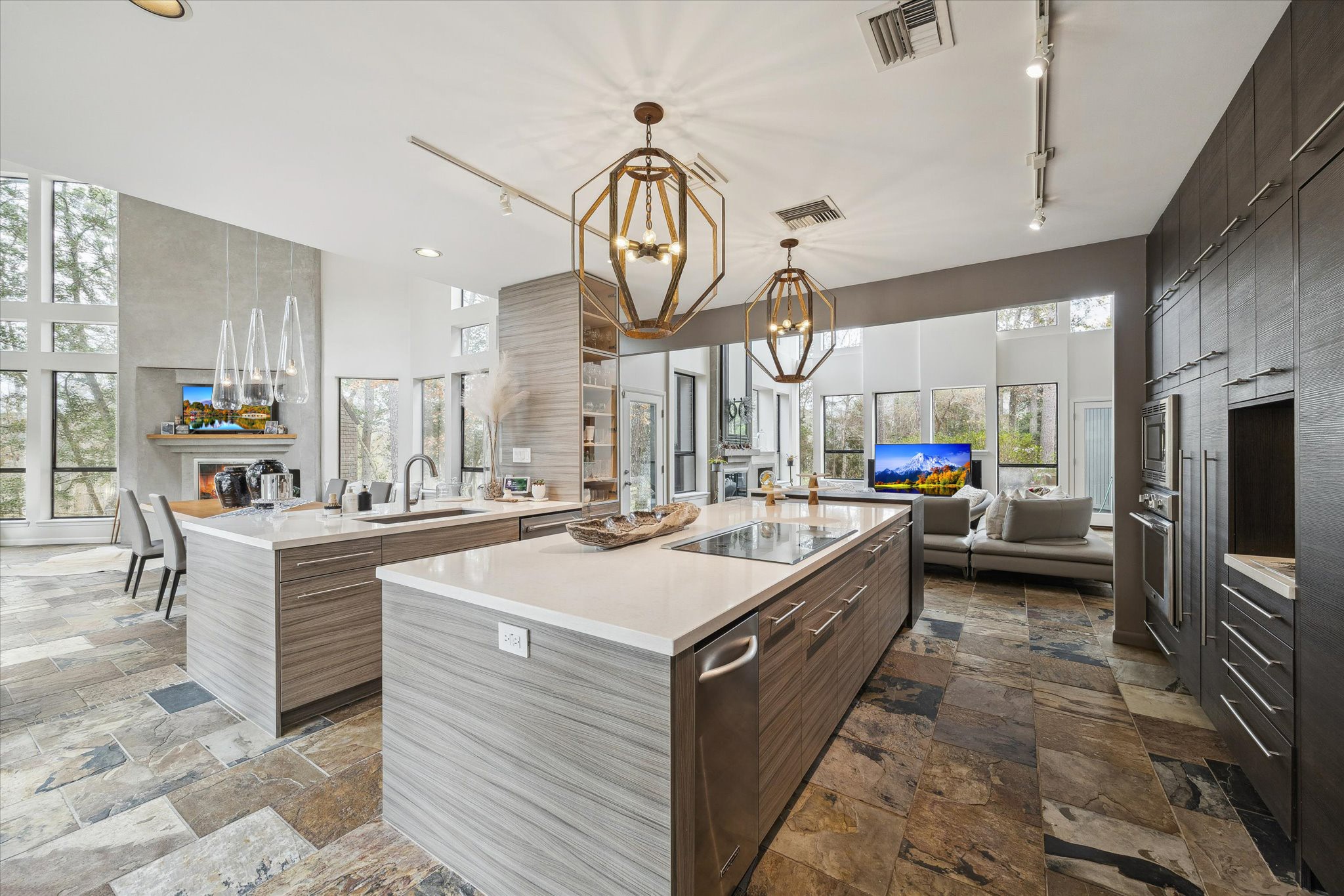 Sleek, modern kitchen designed for both functionality and style, featuring custom flat-panel cabinetry, Thermador appliances, and expansive Quartzite countertops.