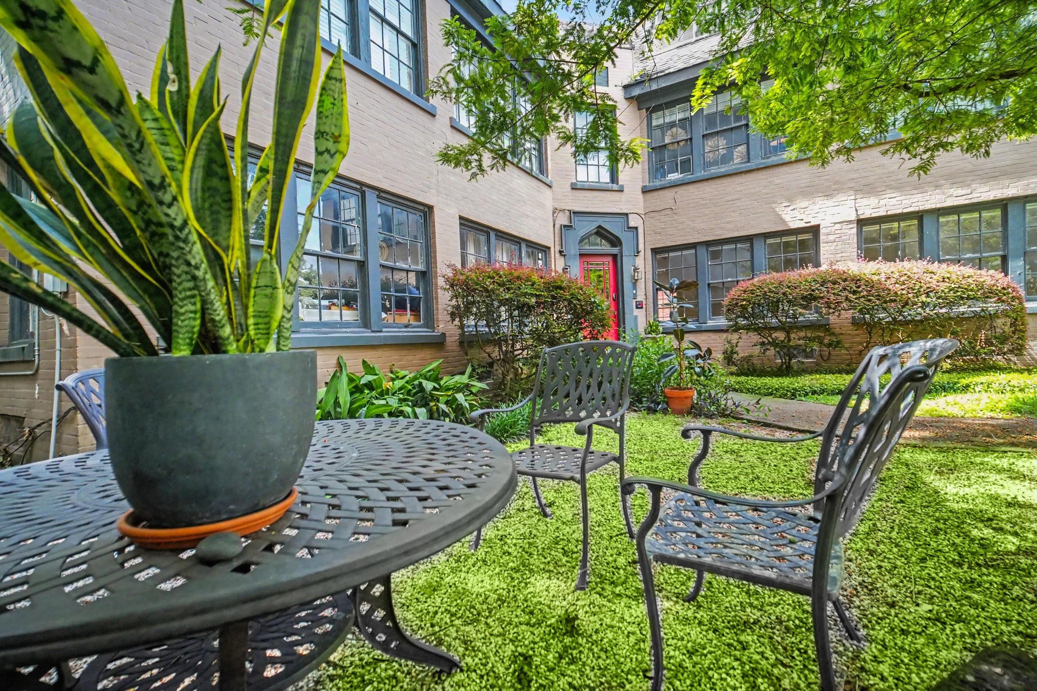 Building grounds include outdoor seating area for tenant use.