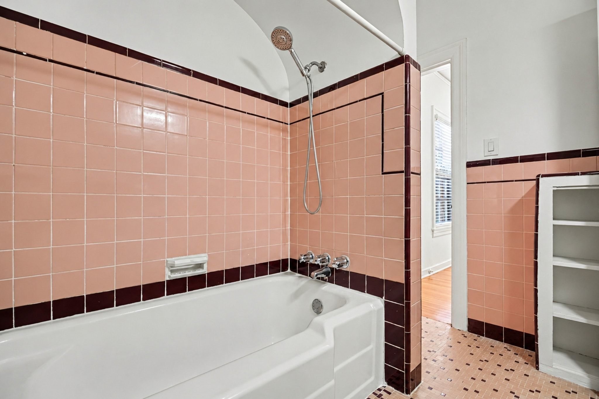 Another view of the vintage primary bath with built in storage.