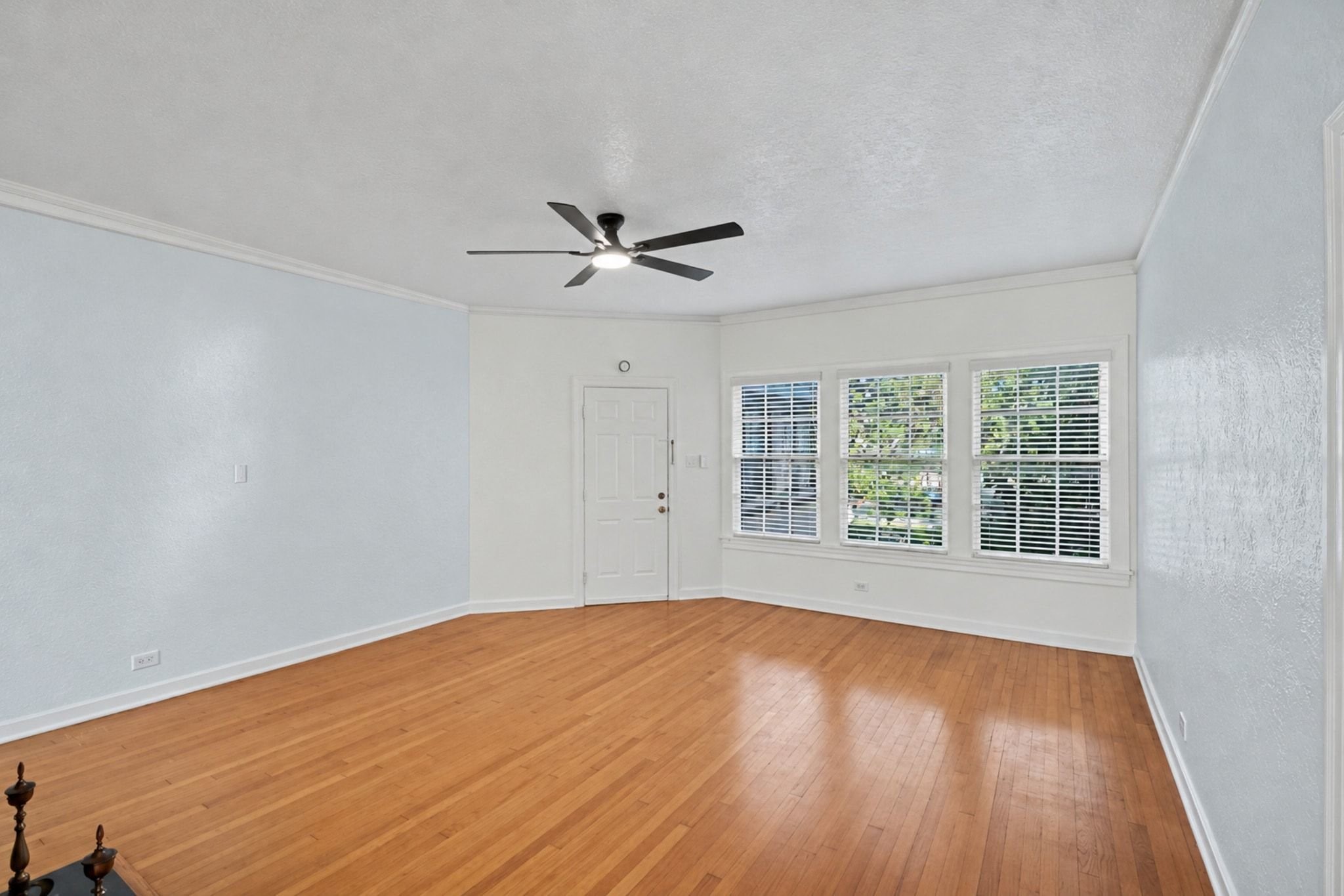 Another view of the large living room with an abundance of windows and light.