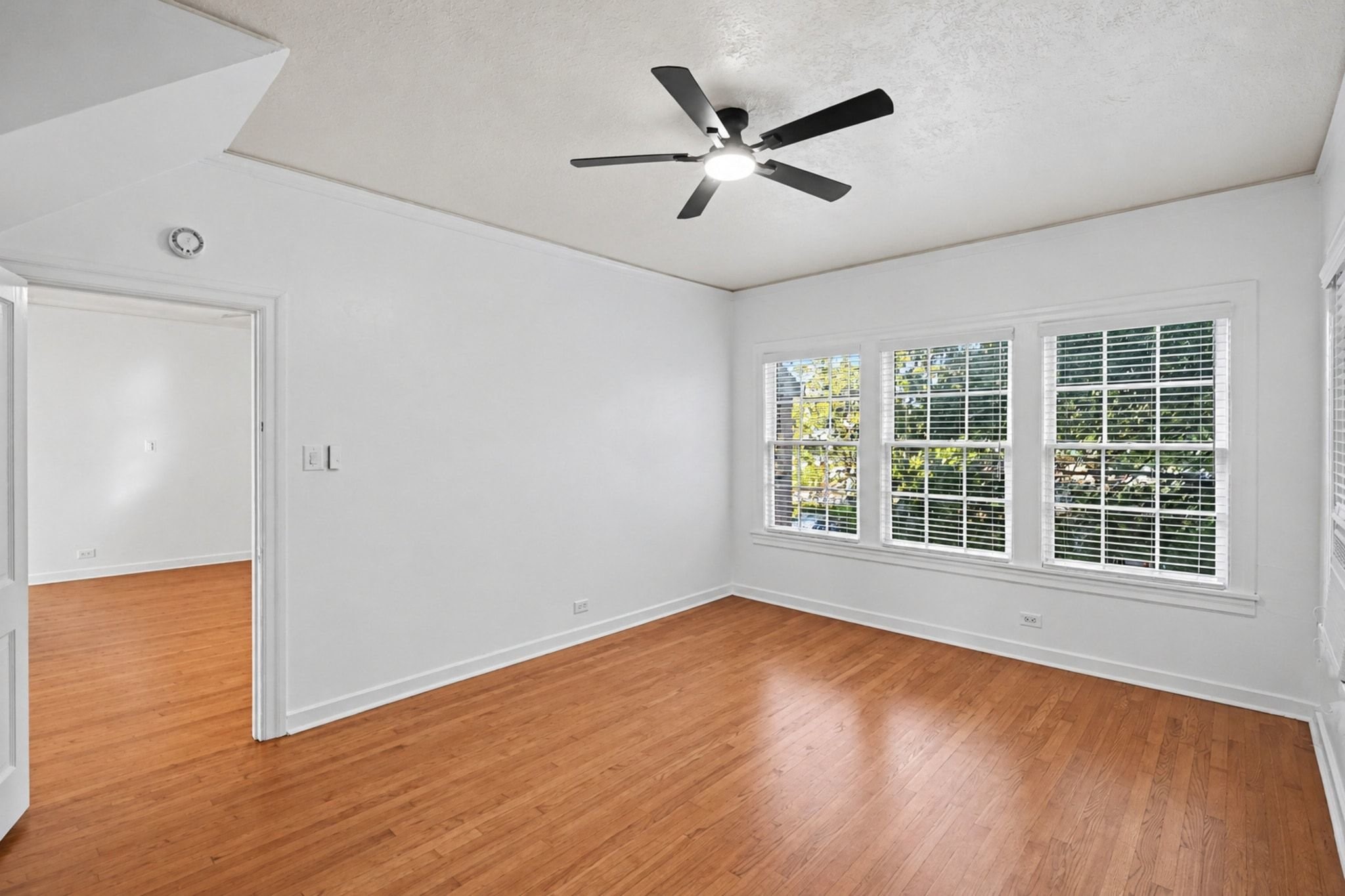 One of two primary suites with tons of windows and light.