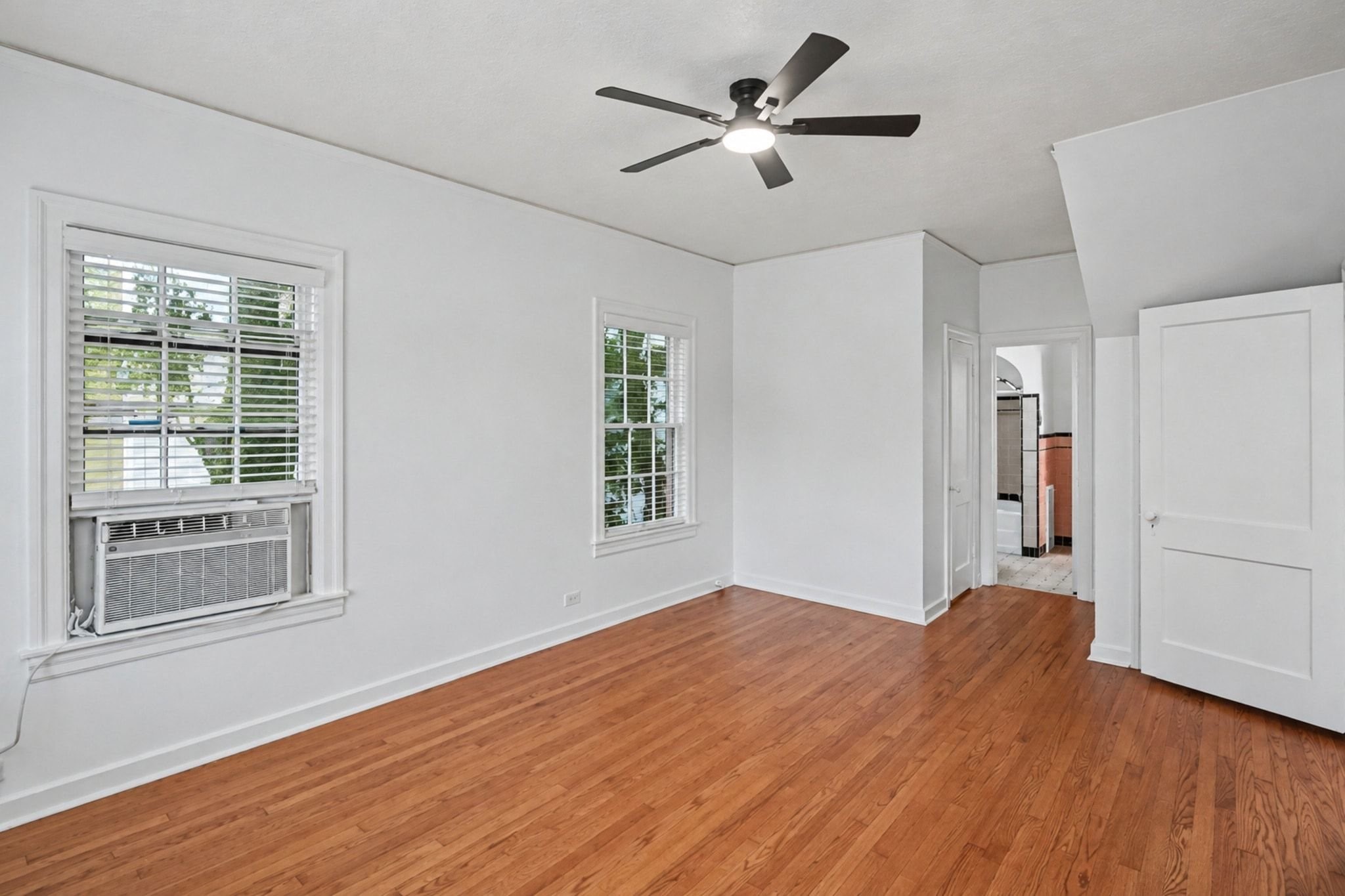 The first primary suite is just off the living room and features two closets.