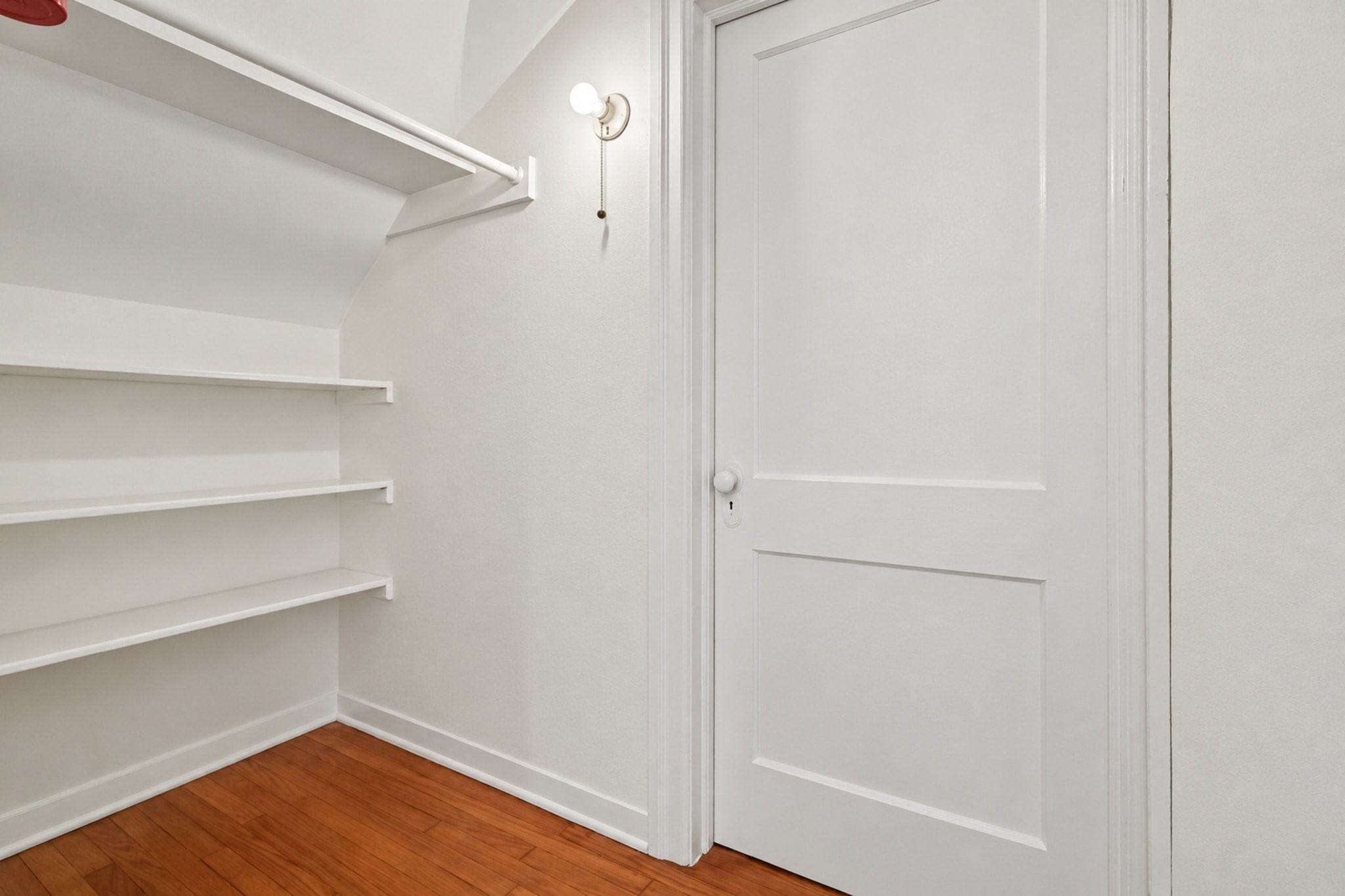 One of two closets in the upstairs second primary suite.