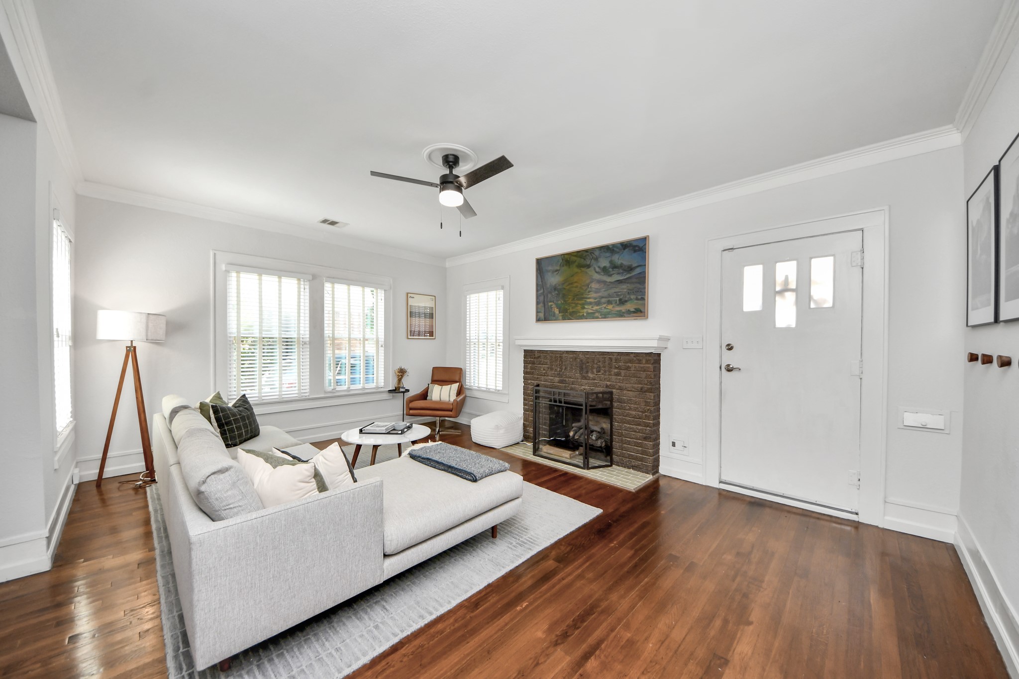 A welcoming living space where historic charm meets everyday comfort, offering a versatile setting for relaxing or entertaining. A welcoming living space where historic charm meets everyday comfort, offering a versatile setting for relaxing or entertaining.