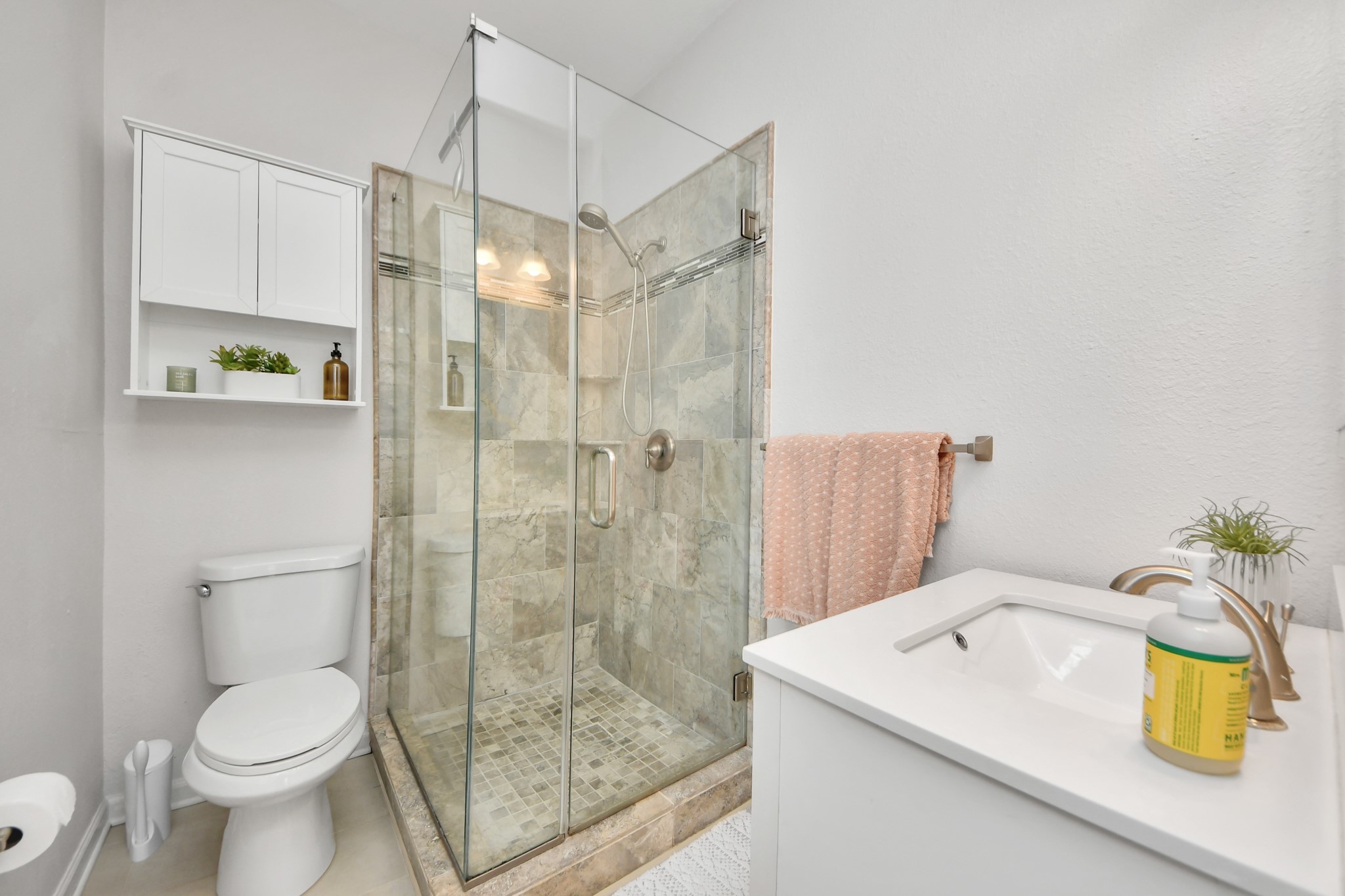 The primary bathroom offers a comfortable and functional space designed to complement everyday living with ease and convenience.