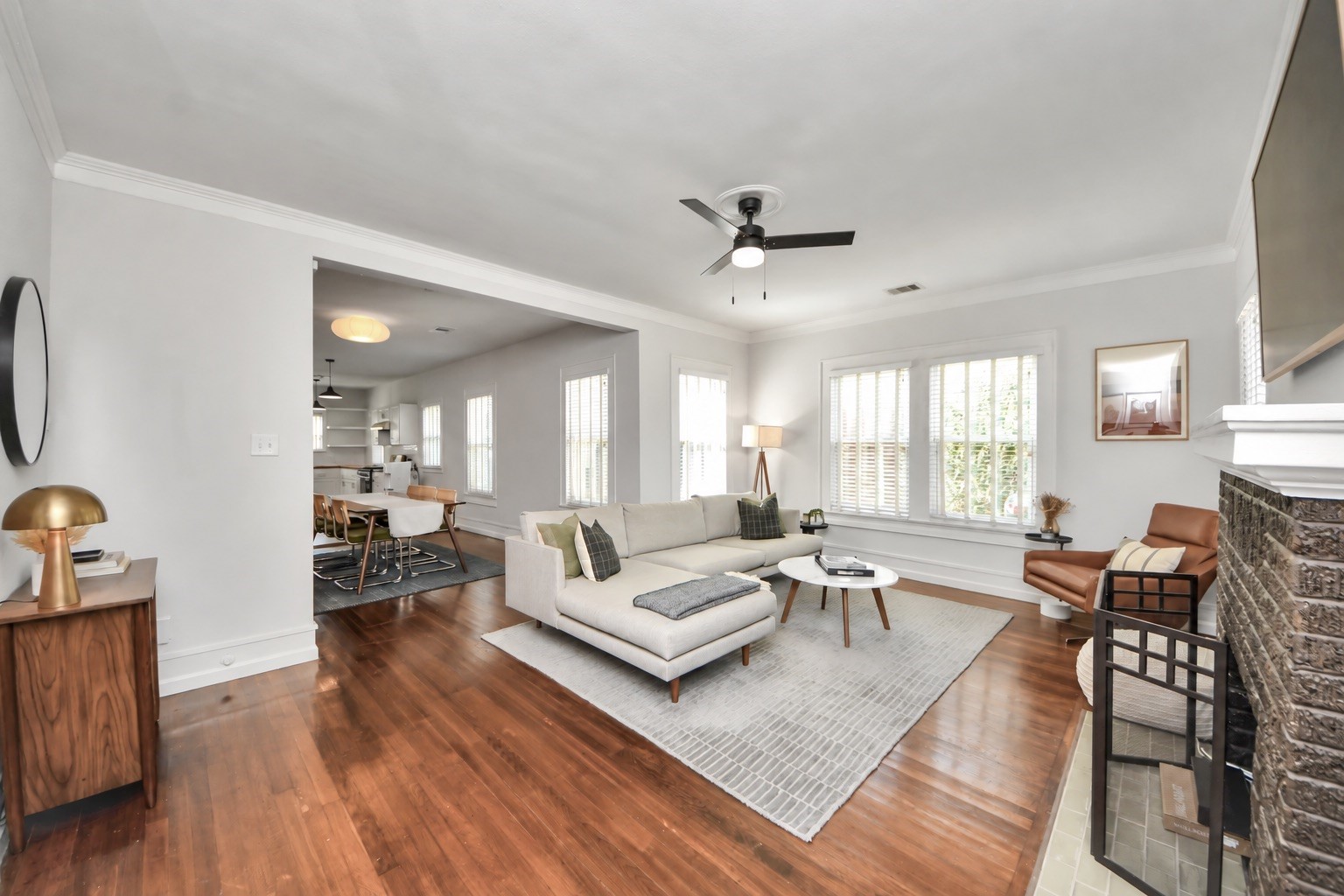 Warm and inviting, the living room showcases hardwood floors that bring timeless character to this beautifully maintained 1941 bungalow. Warm and inviting, the living room showcases hardwood floors that bring timeless character to this beautifully maintained 1941 bungalow.