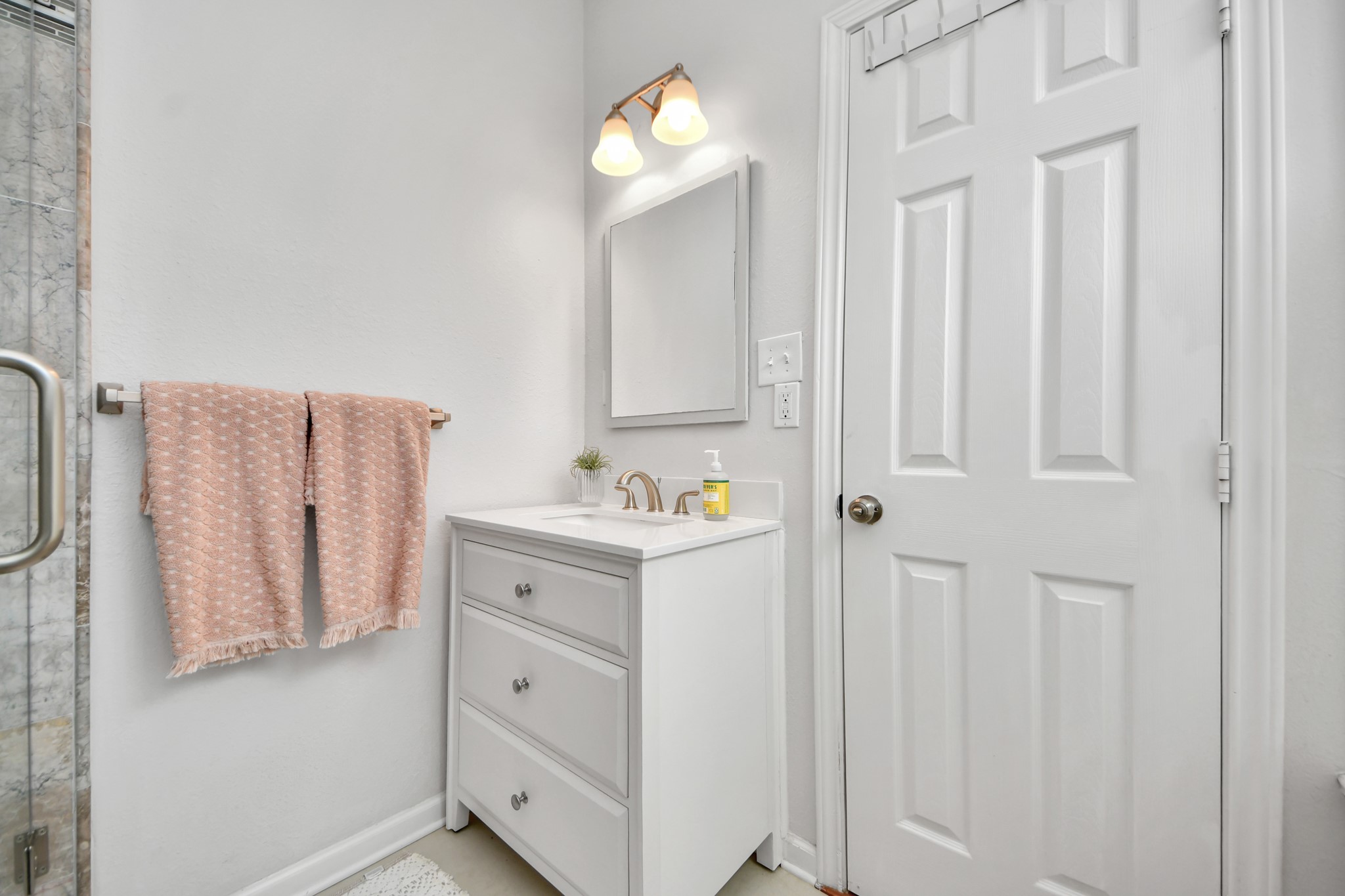 A private retreat within the primary suite, this bathroom provides a practical and inviting space to begin and end each day.
