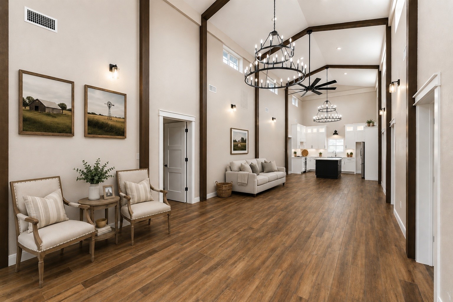 This spacious room features high ceilings with elegant chandeliers and exposed beams, complemented by warm tile wood-style flooring. It leads into a modern kitchen with white cabinetry and an island, offering an open, airy feel perfect for both entertaining and everyday living. AI decorated photo.