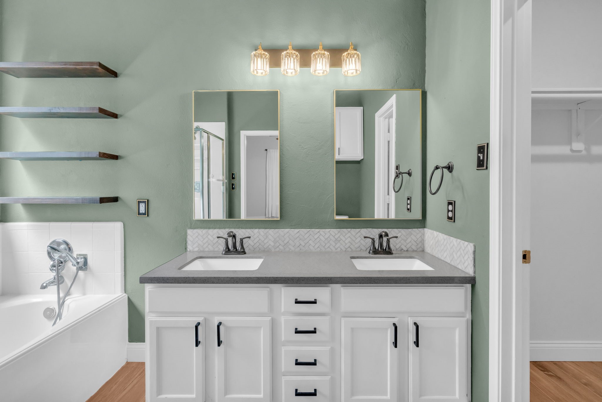 This modern vanity has lots of storage and a beautiful countertop.