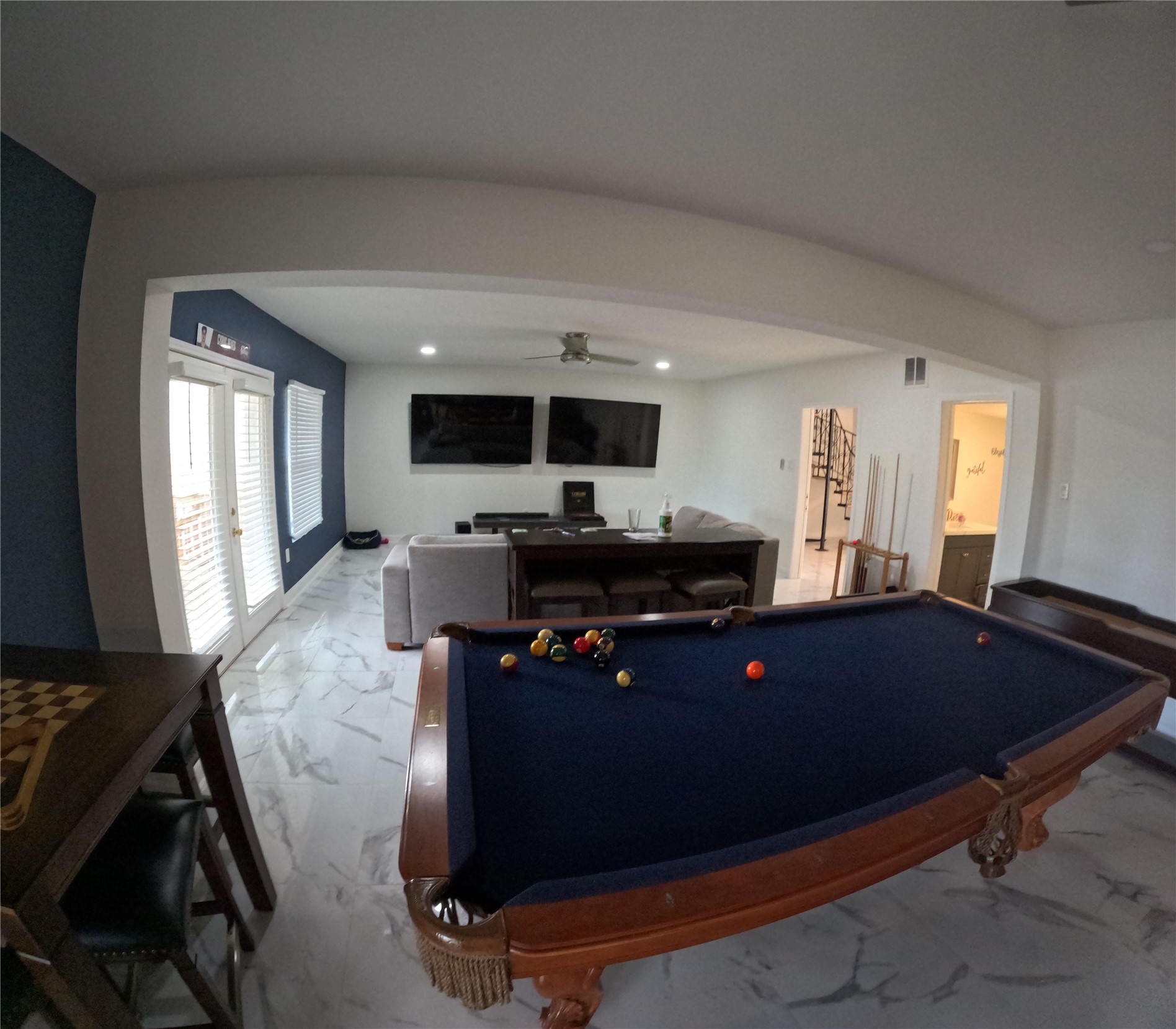 Looking across the large entertainment room on the second floor