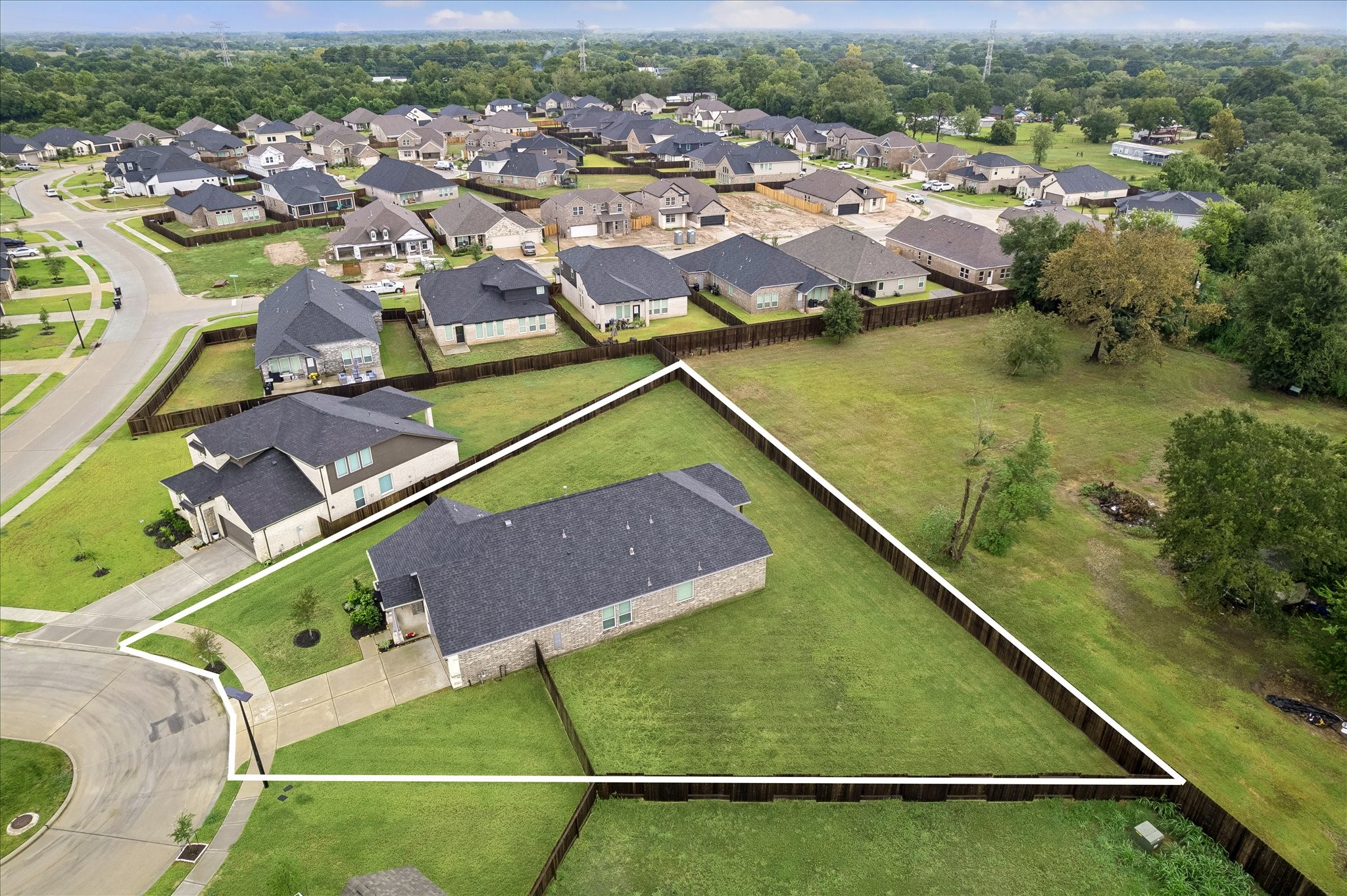 This house has the largest lot in the neighborhood.