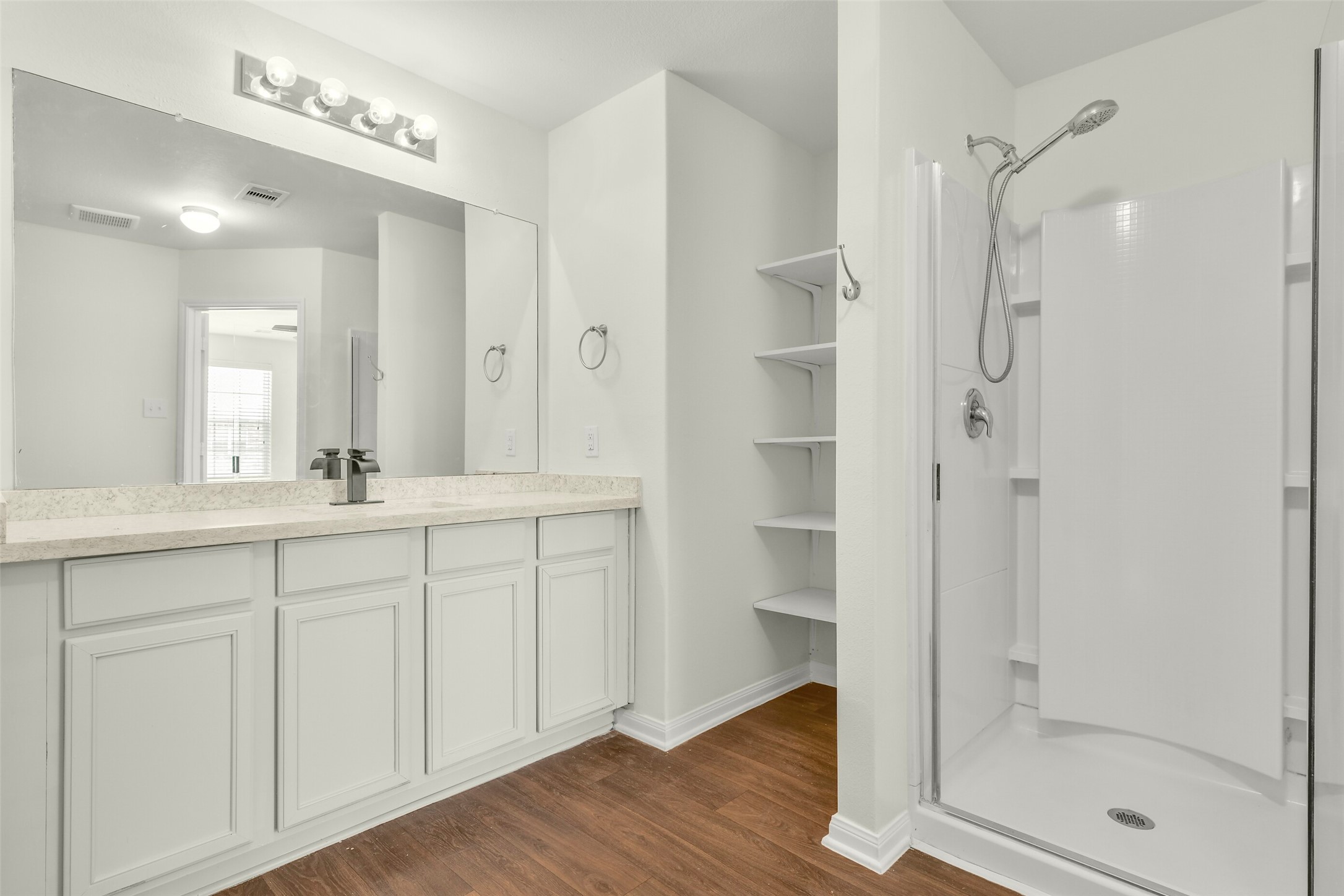 Relaxing ensuite bath featuring garden tub, separate shower, and updated finishes.