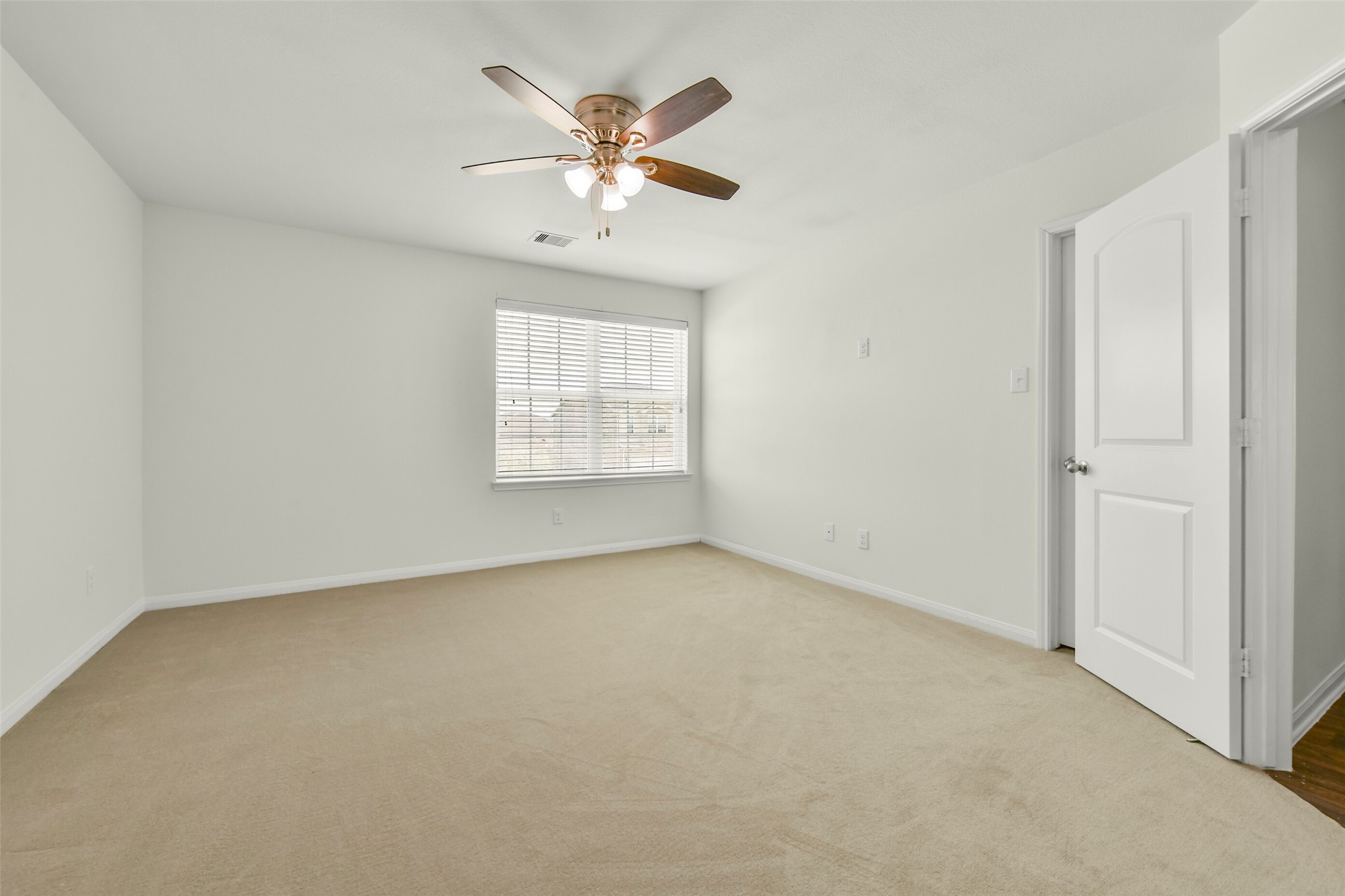Generous primary suite with comfortable layout and ample natural light.