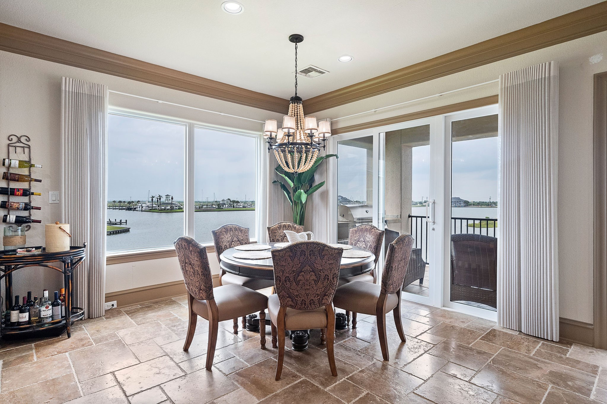 The dining area offers captivating views of Harborwalk Marina and the Marina Channel