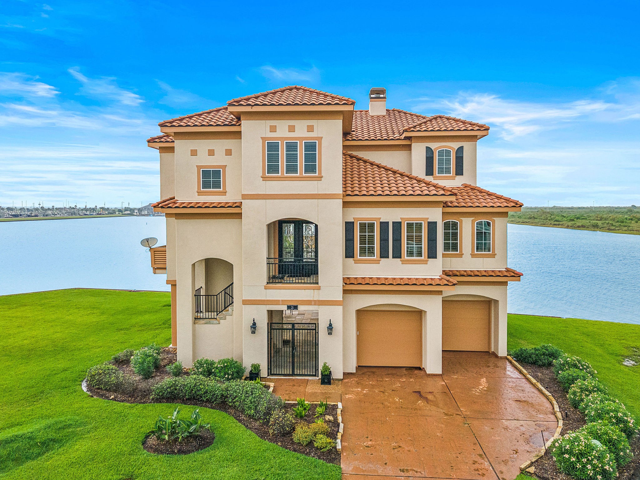 Welcome to your coastal Mediterranean villa, where waterfront luxury meets bayside living. This stunning home features a boathouse w/ lift, lush landscaping, & inviting outdoor dockside living. Enjoy direct access to West Galveston Bay, with breathtaking views of Harborwalk Marina and the Marina Channel. Custom touches are found throughout, and sweeping waterfront views can be seen from every angle. The adjacent homesite to the left is included, offering additional space for a pool - all in a prime location Welcome to your coastal Mediterranean villa, where waterfront luxury meets bayside living. This stunning home features a boathouse w/ lift, lush landscaping, & inviting outdoor dockside living. Enjoy direct access to West Galveston Bay, with breathtaking views of Harborwalk Marina and the Marina Channel. Custom touches are found throughout, and sweeping waterfront views can be seen from every angle. The adjacent homesite to the left is included, offering additional space for a pool - all in a prime location
