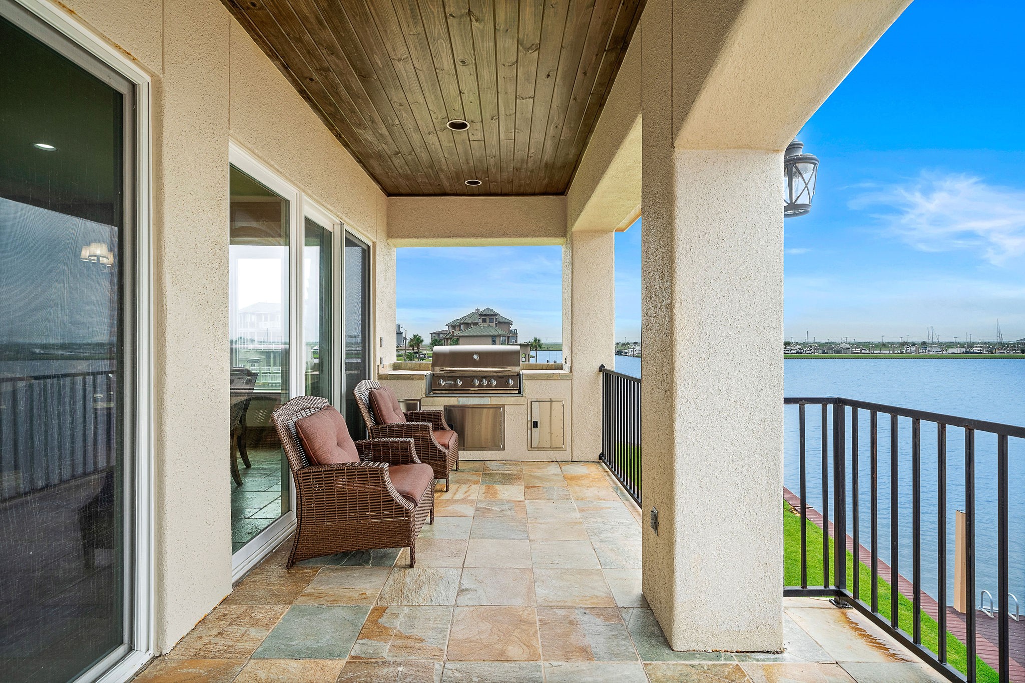Located just off the kitchen, this covered terrace features a seamlessly connected outdoor grillperfect for effortless entertaining and al fresco dining