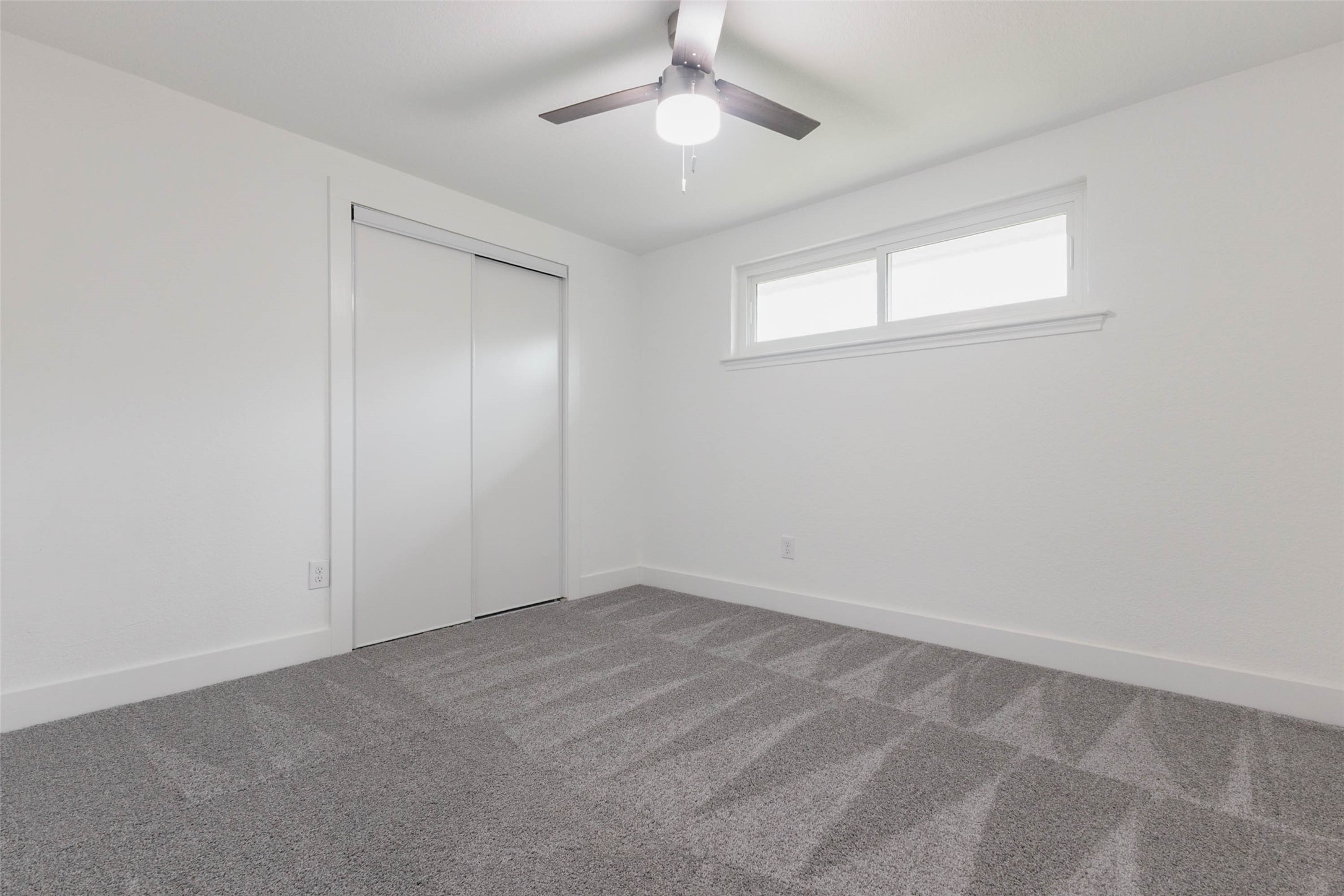 A versatile bedroom ready to become a guest room, personal retreat, or whatever suits your needs.