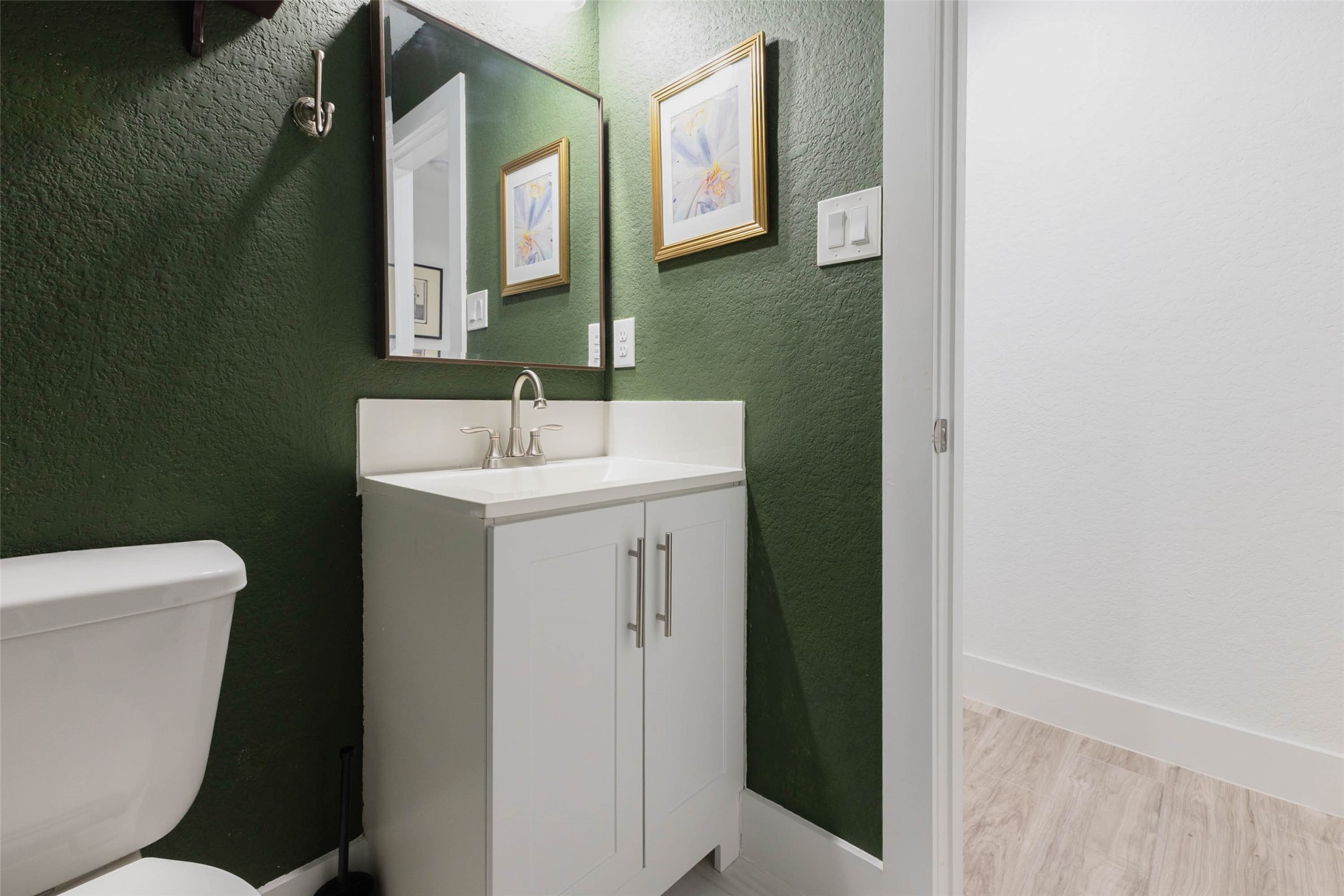 An added convenience for guests and everyday living, keeping the main bedroom suite more private.