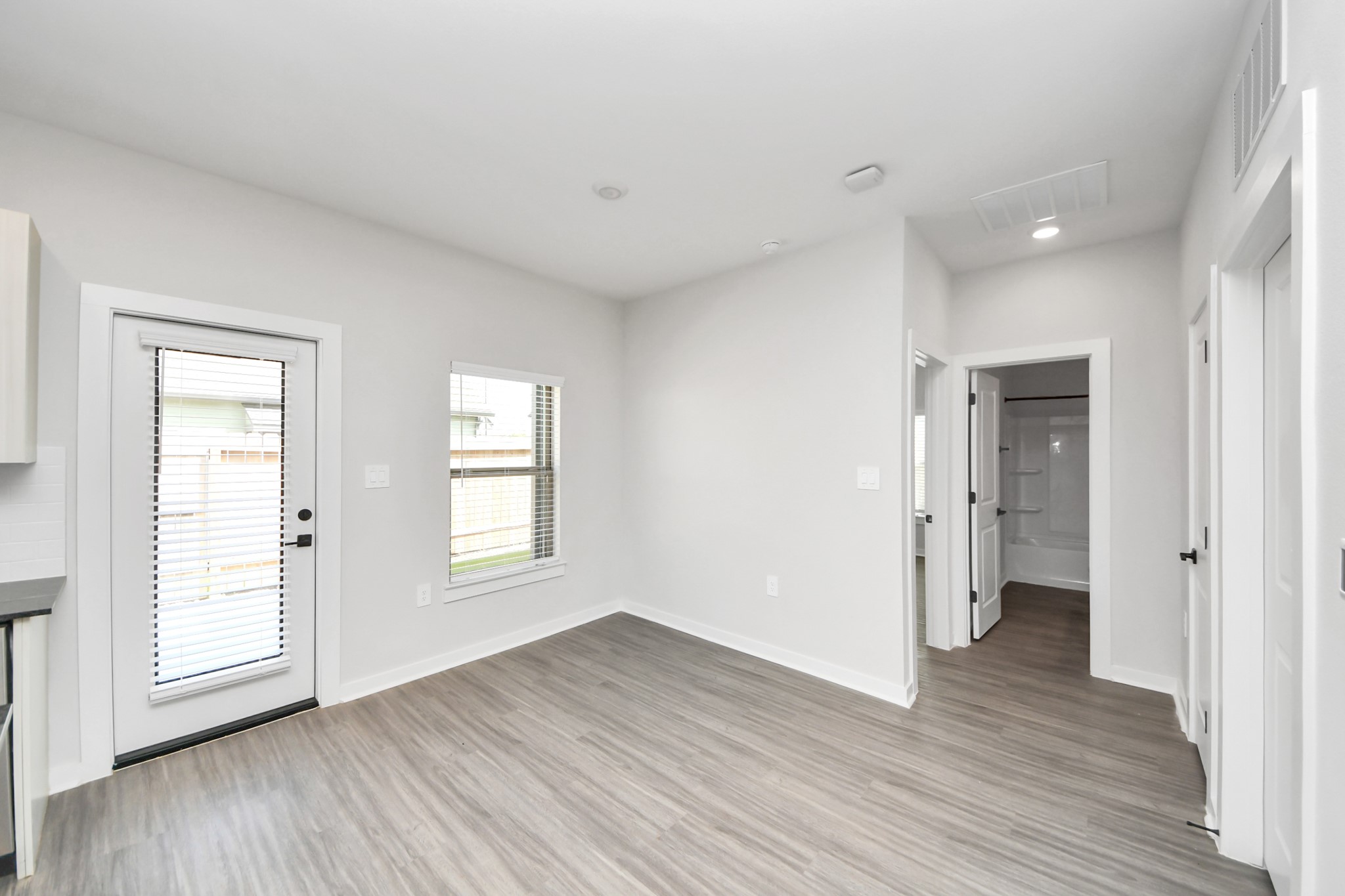Open Concept Floor Plan with wood-like floors throughout!