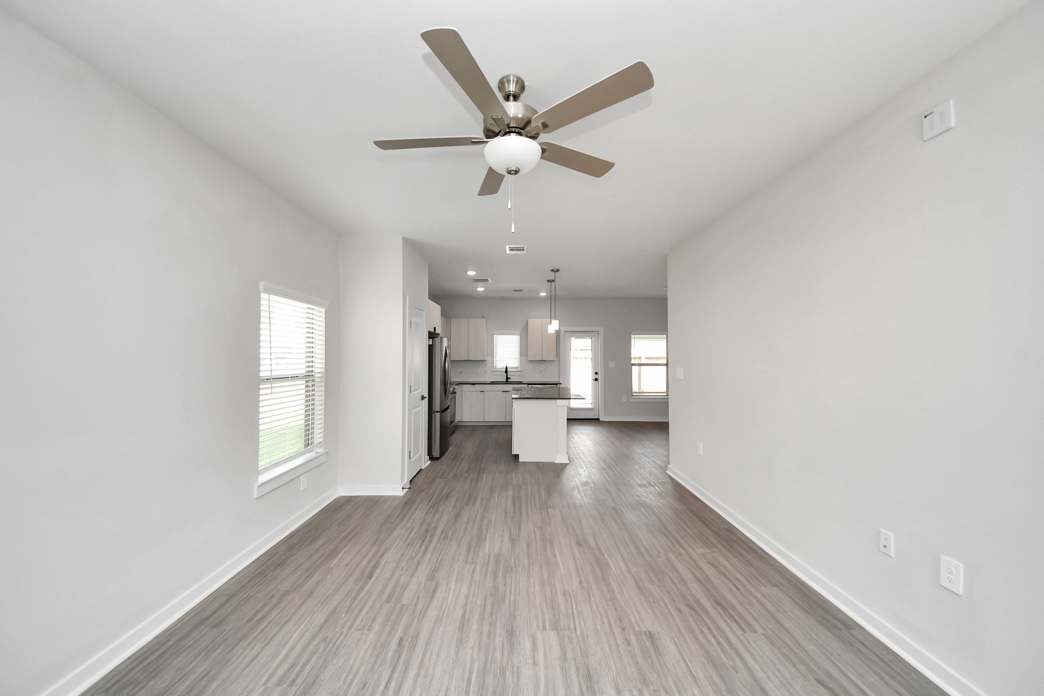 Open Concept Floor Plan with wood-like floors throughout!