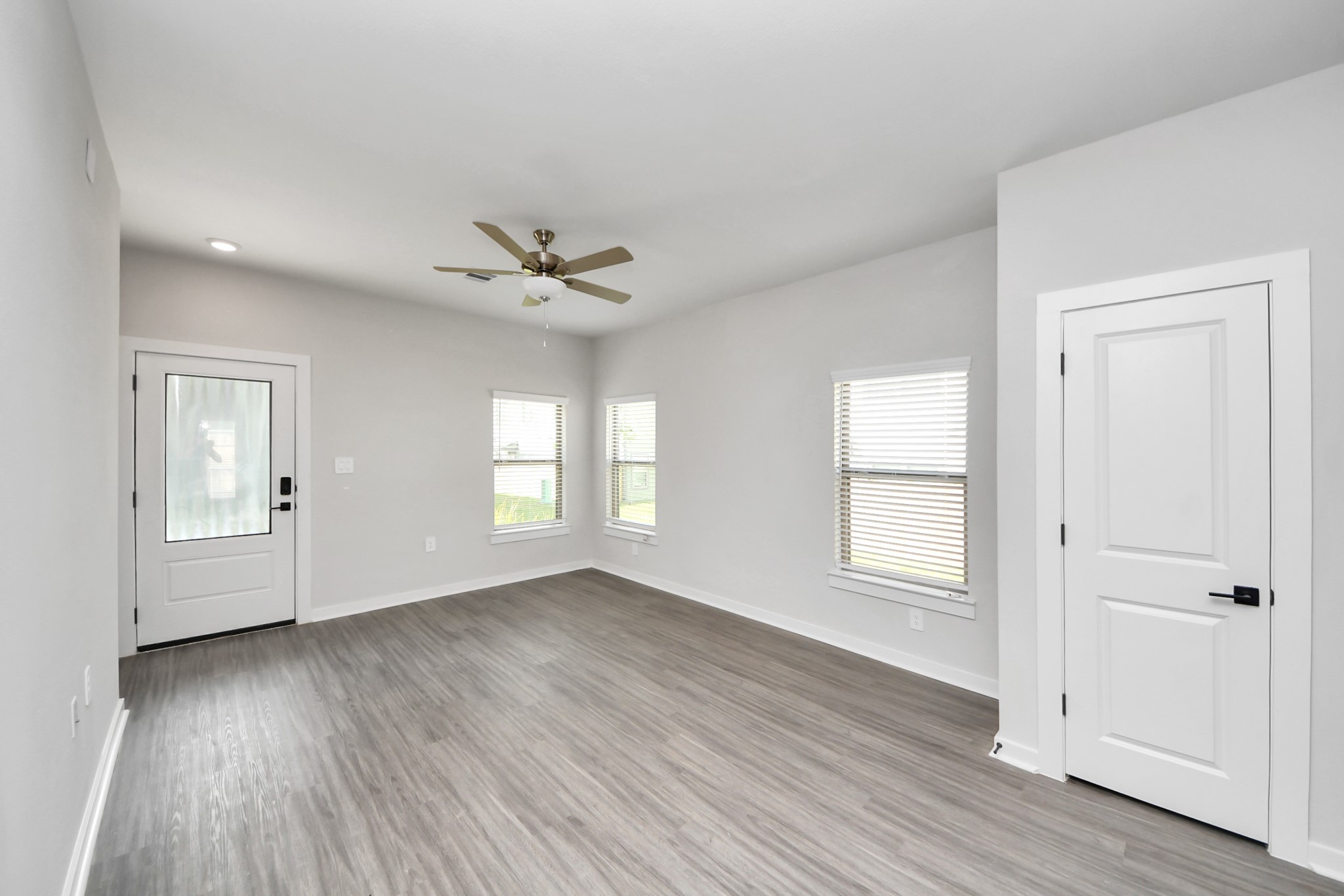 Open Concept Floor Plan with wood-like floors throughout!