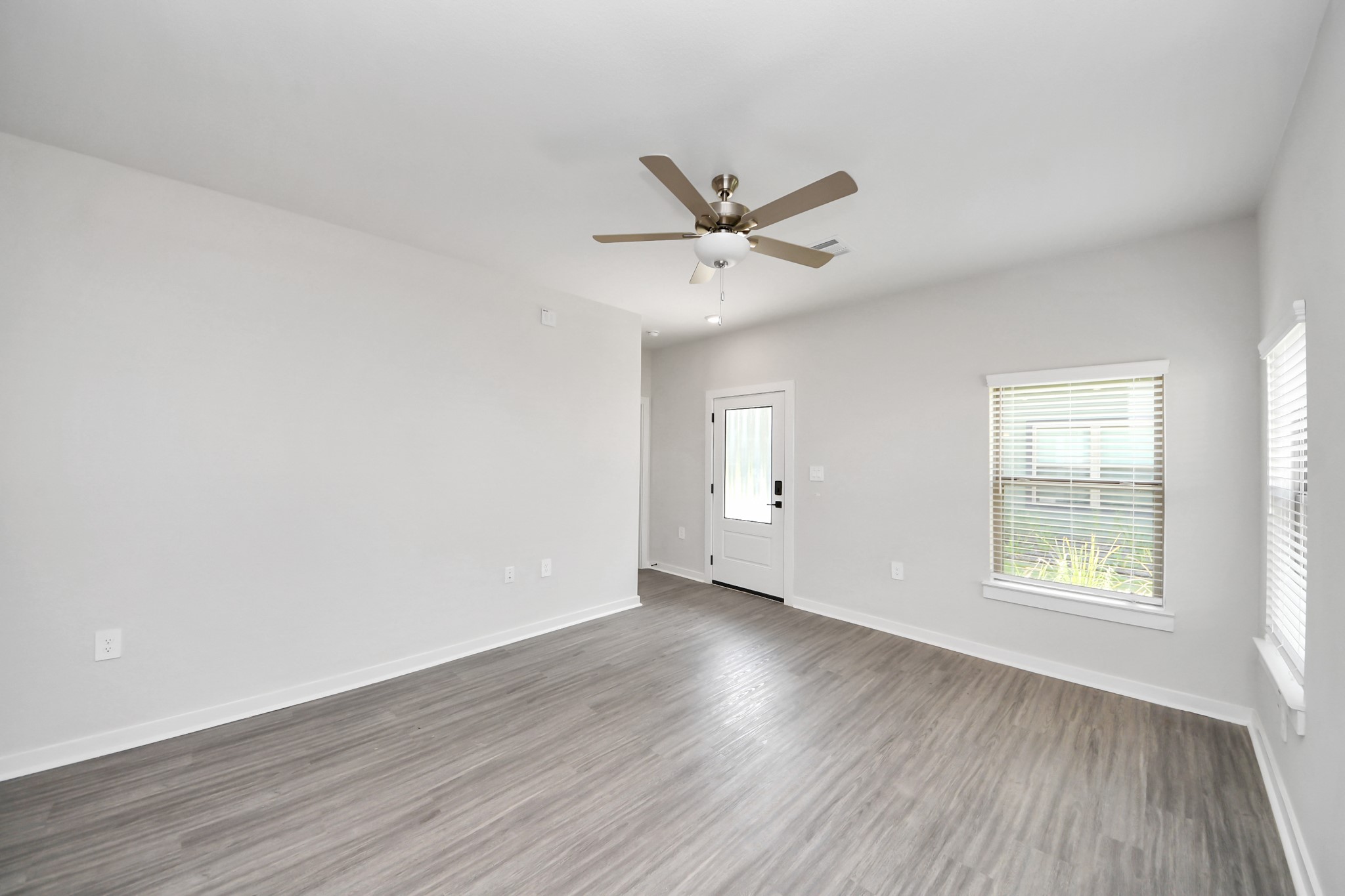Open Concept Floor Plan with wood-like floors throughout!