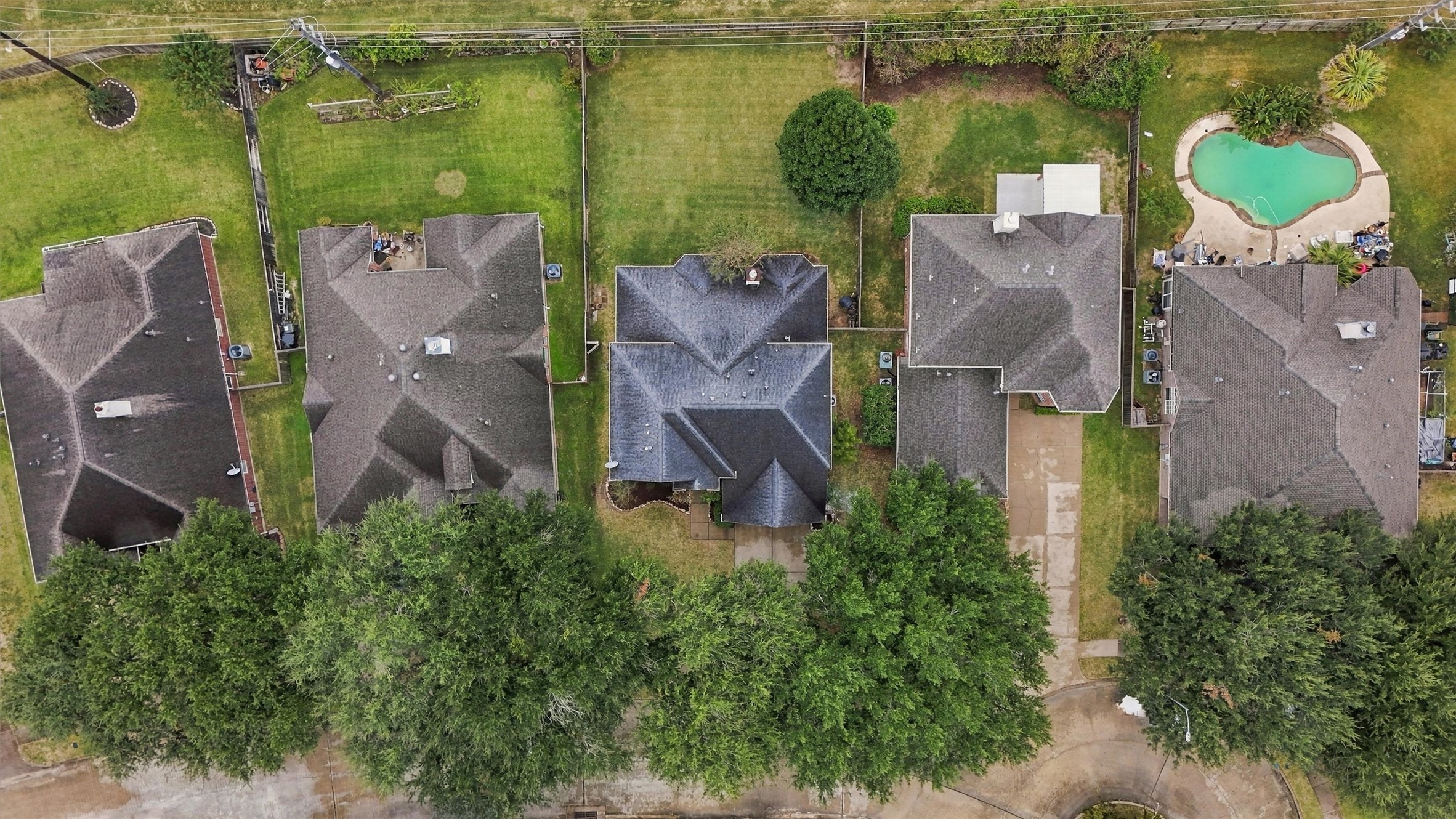 Aerial view showcasing the home's spacious lot and surrounding neighborhood.