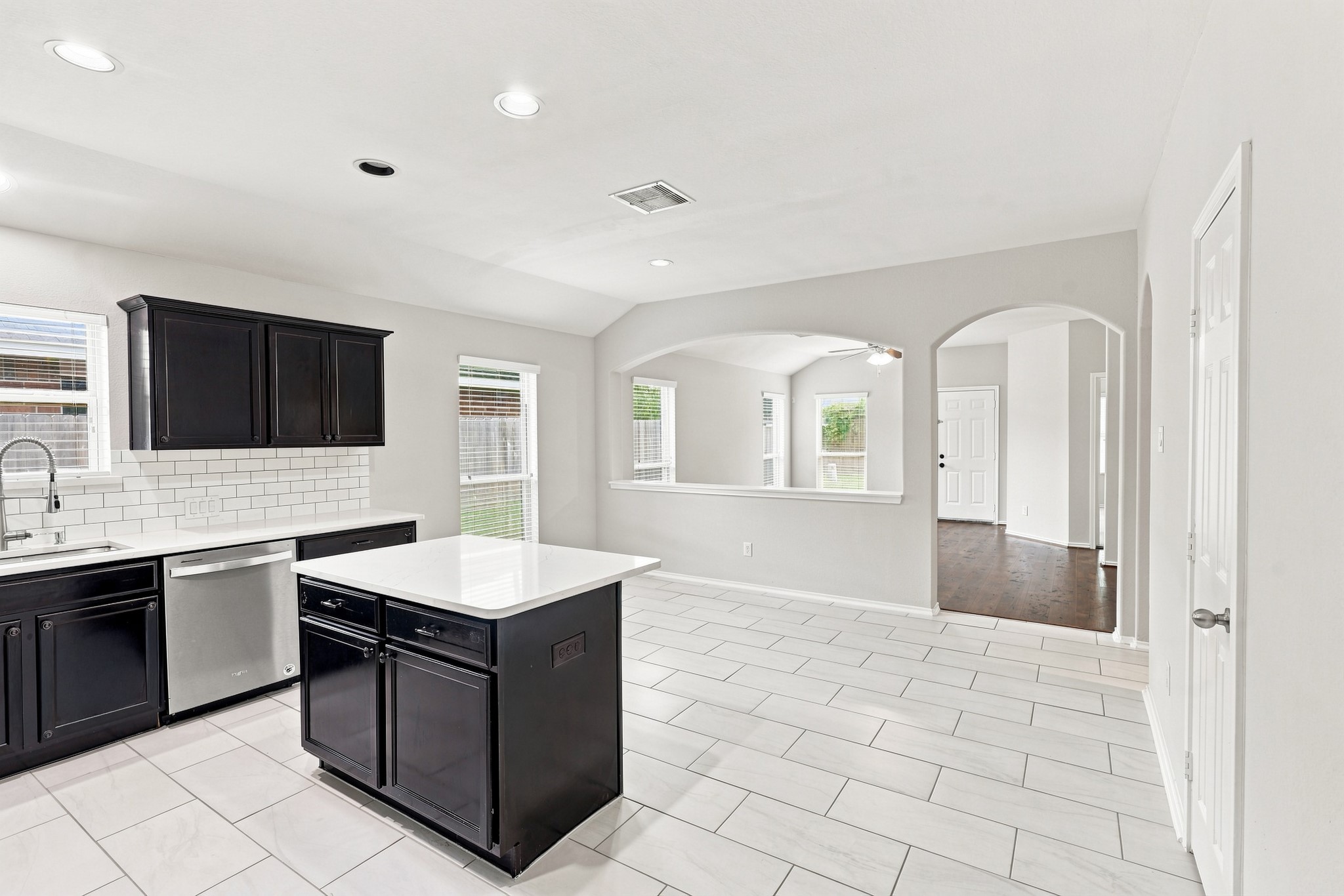 Kitchen and dining area with open sightlines into the adjoining living room