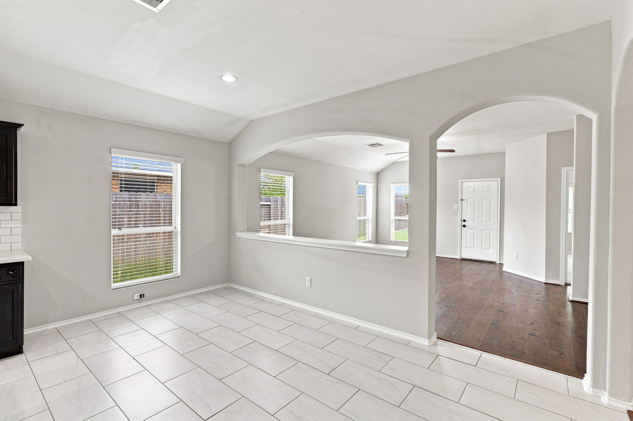 Bright dining area located just off the kitchen with multiple windows for natural light.