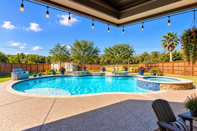 Experience resort-style living with this stunning backyard oasis, featuring a sparkling heated pool, relaxing spa, and a spacious patio perfect for entertaining.