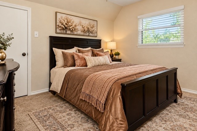 Cozy 2nd bedroom with fresh paint and a large window for natural sunlight to come in.