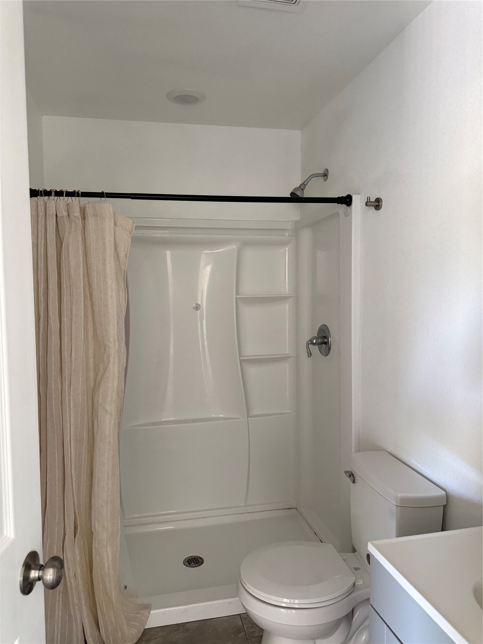 Clean bathroom with a walk-in shower and a modern vanity.